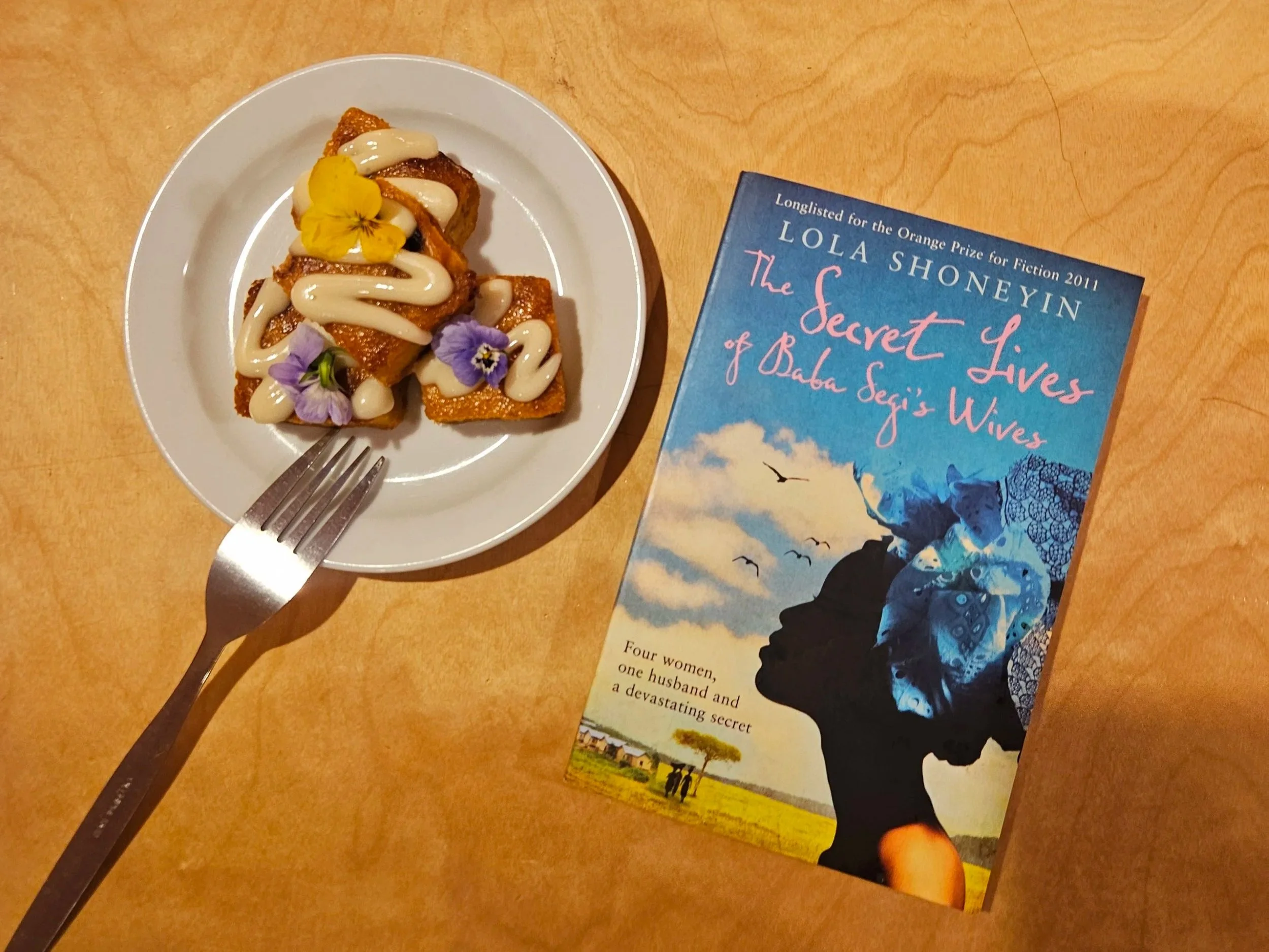 Book on Chuku's Table Next to Moi Moi.jpg