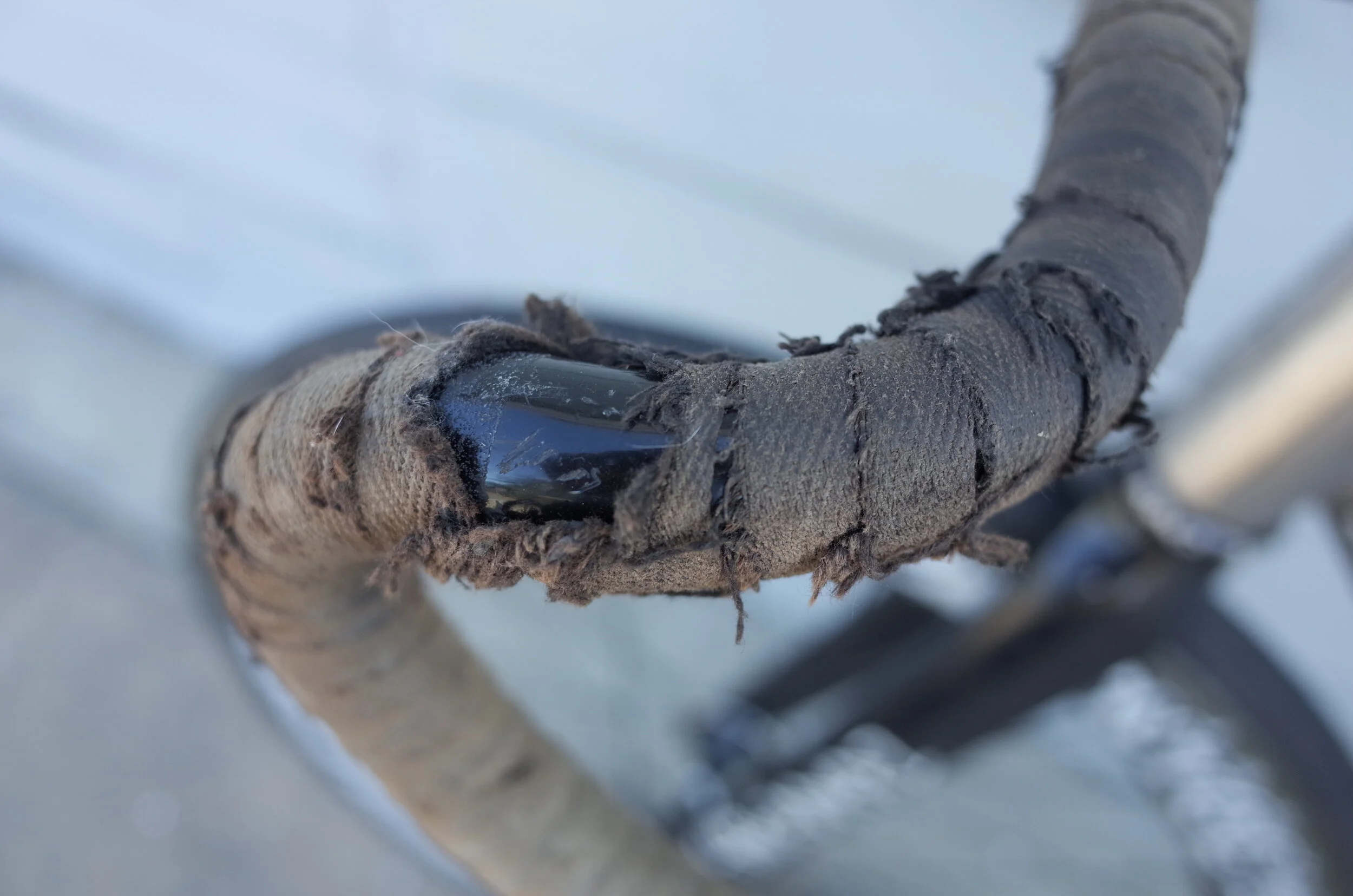  The cheapest cloth tape you can buy,  wrap it very tight, shred on it, and keep going till eventually there is no bar tape left on the bars.  Should last about 2-7 years depending. 