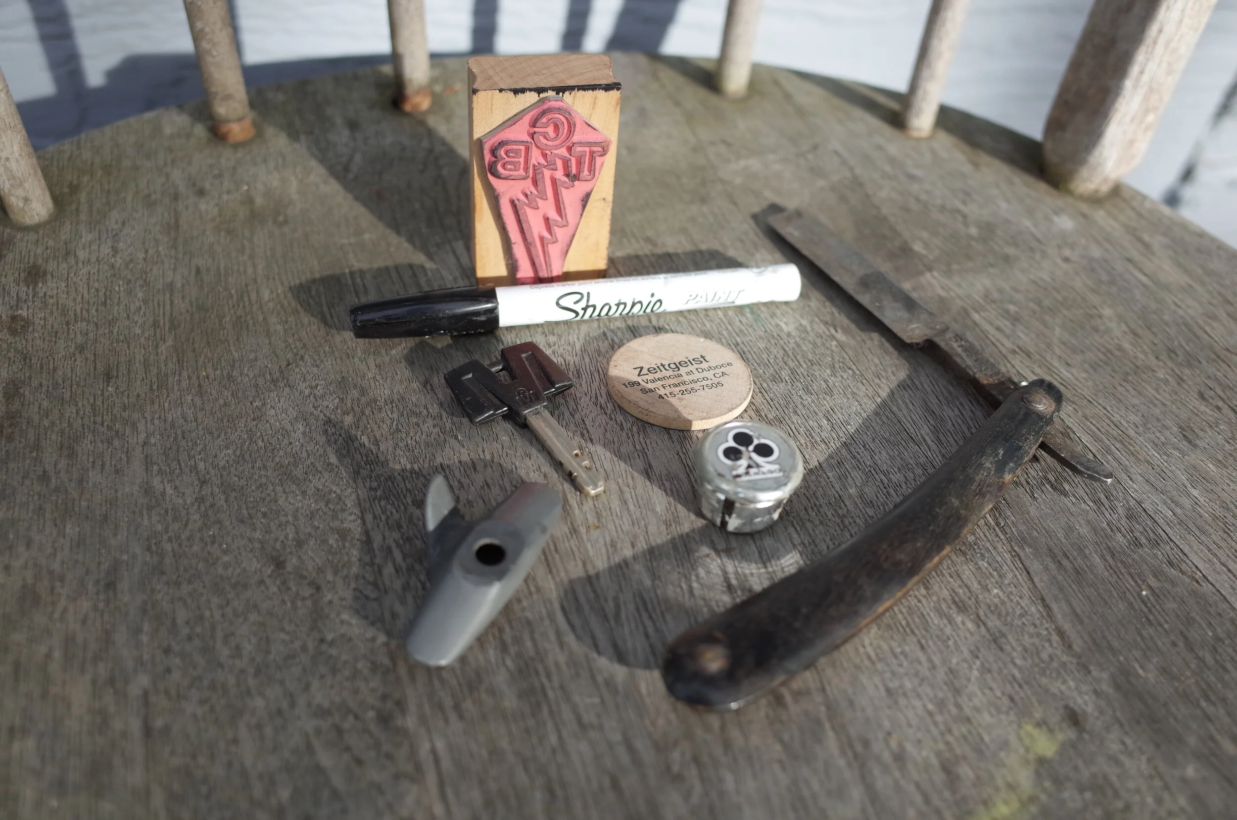  Floating around the bottom of the box was this mixed bag of stuff.  Before TCB has business cards we had this stamp, with the lightening bolt switched backwards in a weak attempt to avoid copyright issues with Elvis LOL.  Shimano DURACE brake pads w