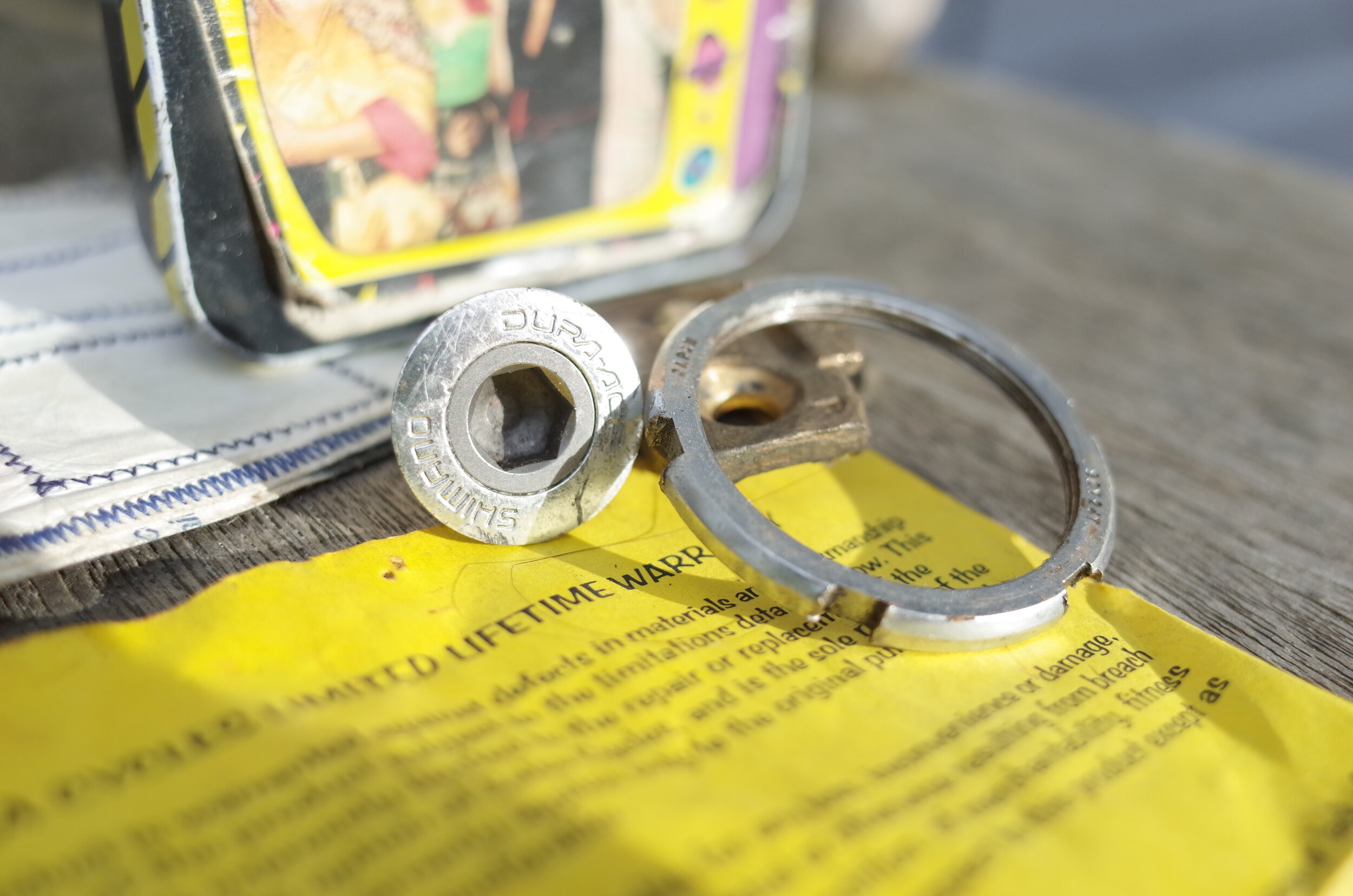  The opposite of the Campy dust cover is the methodically and practically engineered Shimano DURACE integrated dust cap and crank bolt.  Not choosing sides here, just saying that if you include your dust cover on the crank bolt you will never need to