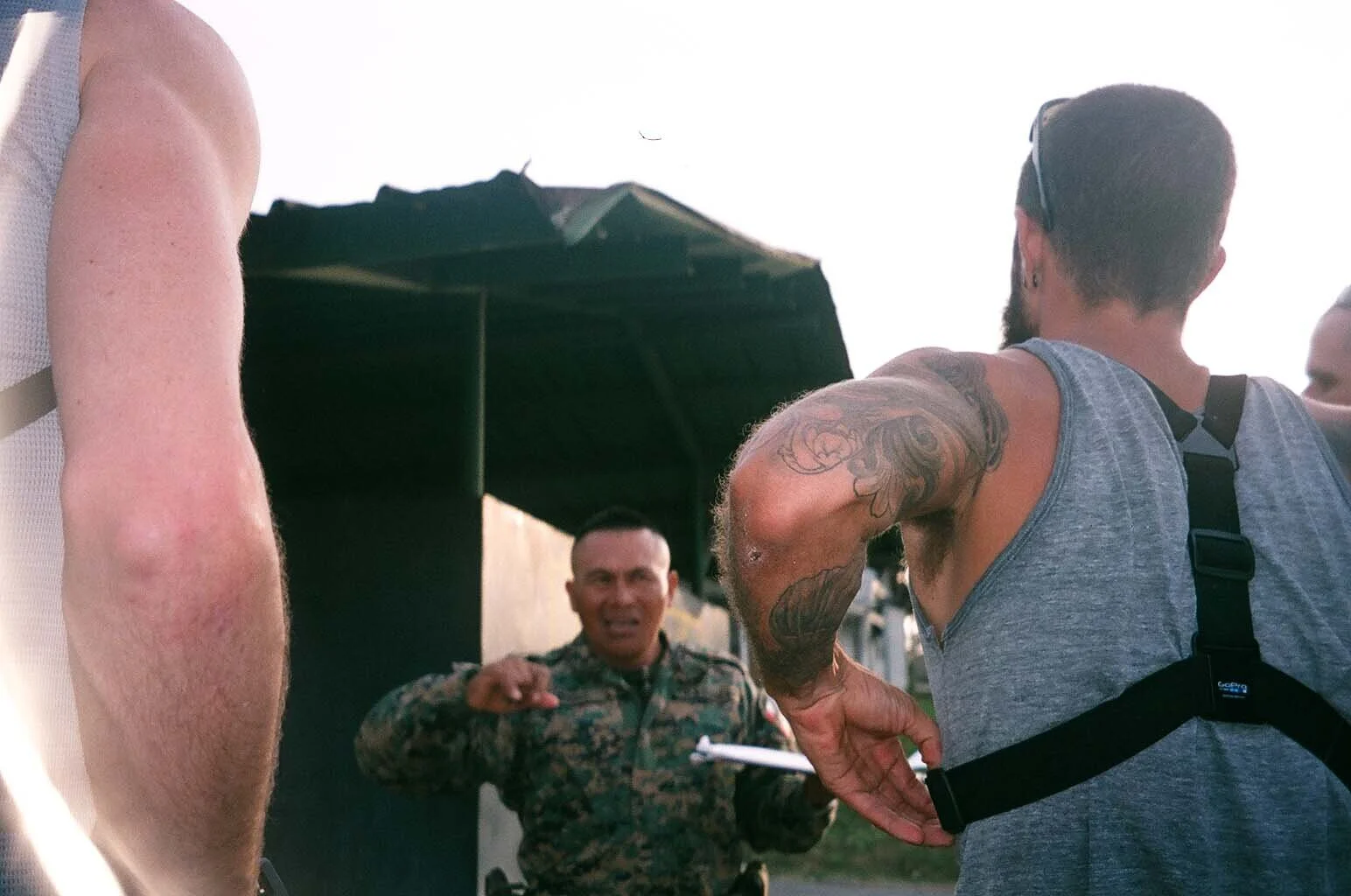  Explaining our way through yet another border checkpoint.  I brought 50 small airplane bottles of whiskey to bribe border guards.. they were all gone by the end of the trip. 