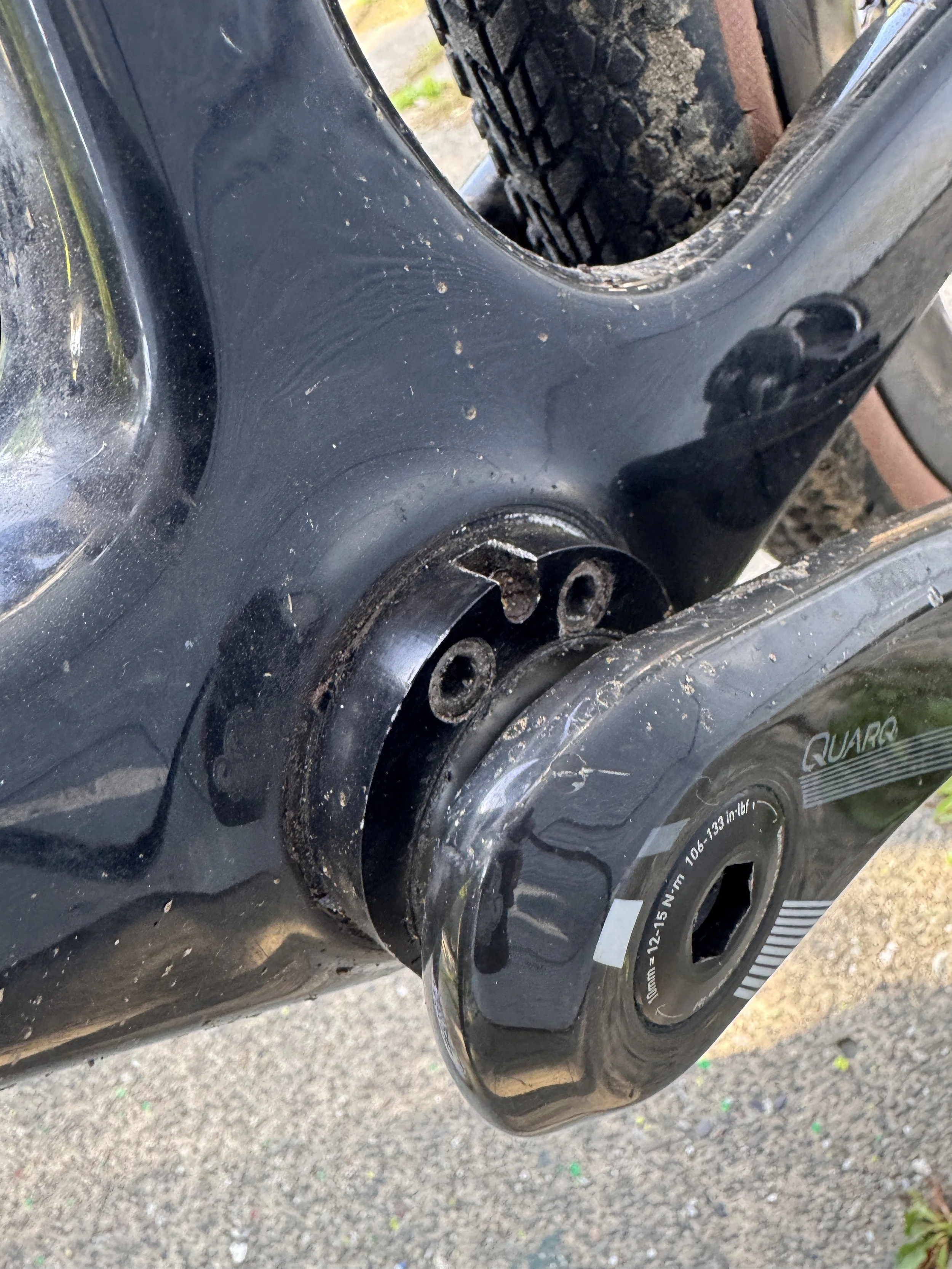  The chain is tensioned with a “ONER” by squid bikes in Sacramento CA.  This is an eccentric bottom bracket.  ec·cen·tric  /ikˈsentrik/   technical: (of a thing) not placed    centr    ally or not h   av   ing its a   xis or other part placed central