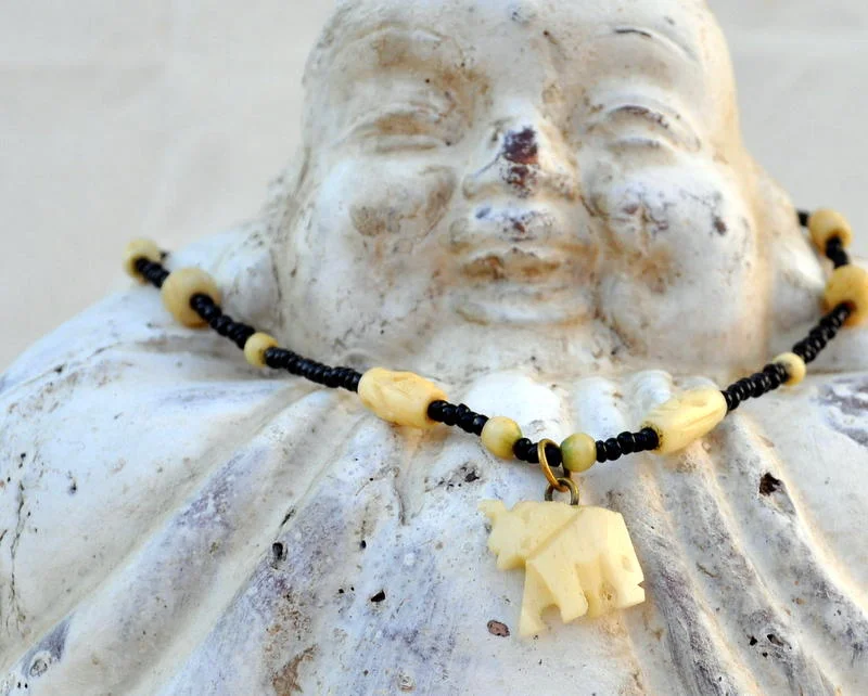 Necklace featuring White Elephant Pendant with Black beads