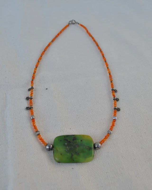 Necklace featuring Green Mohave Turquoise Pendant with Orange Carnelian beads