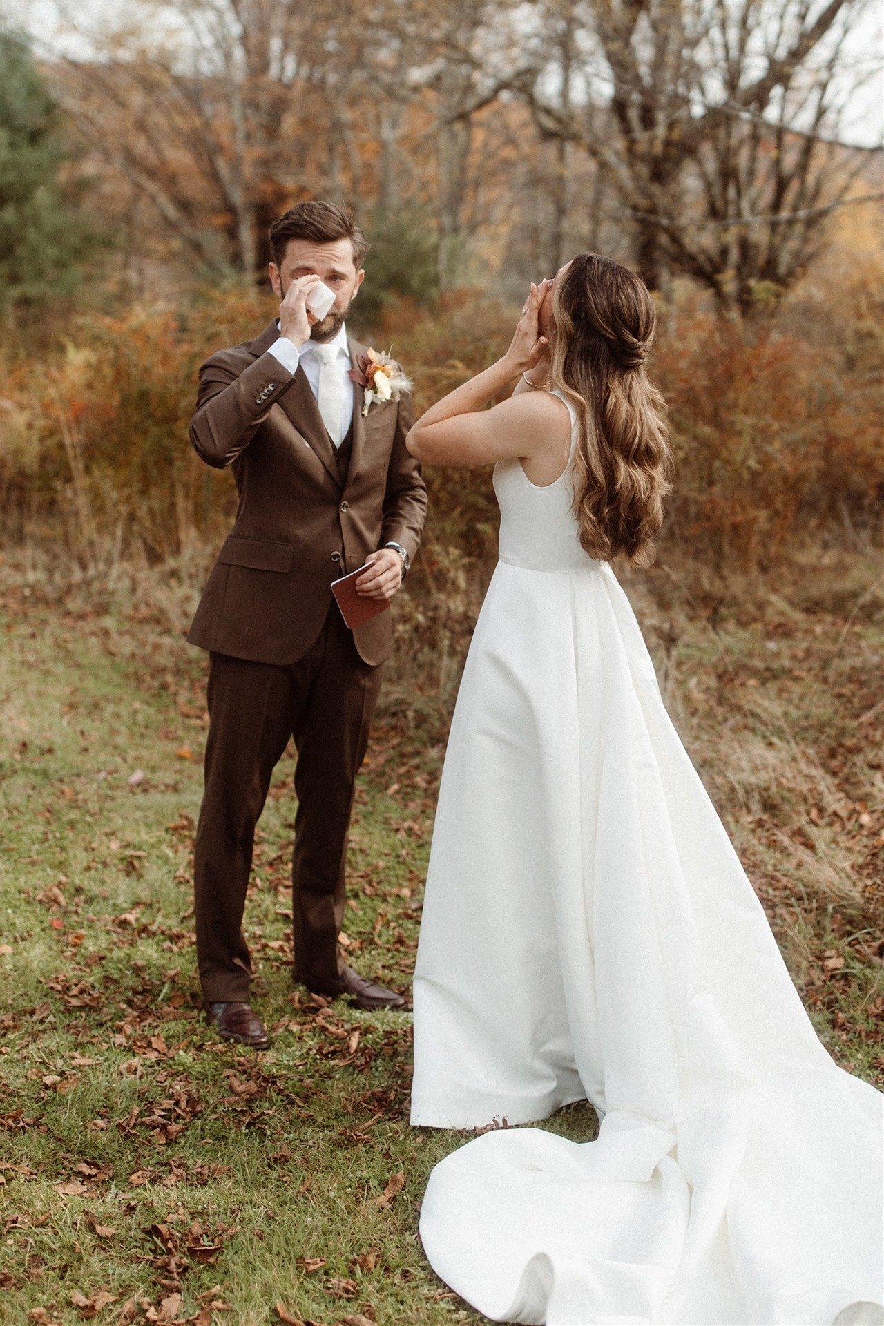 Bride-And-Groom-Drying-Their-Tears-During-First-Look