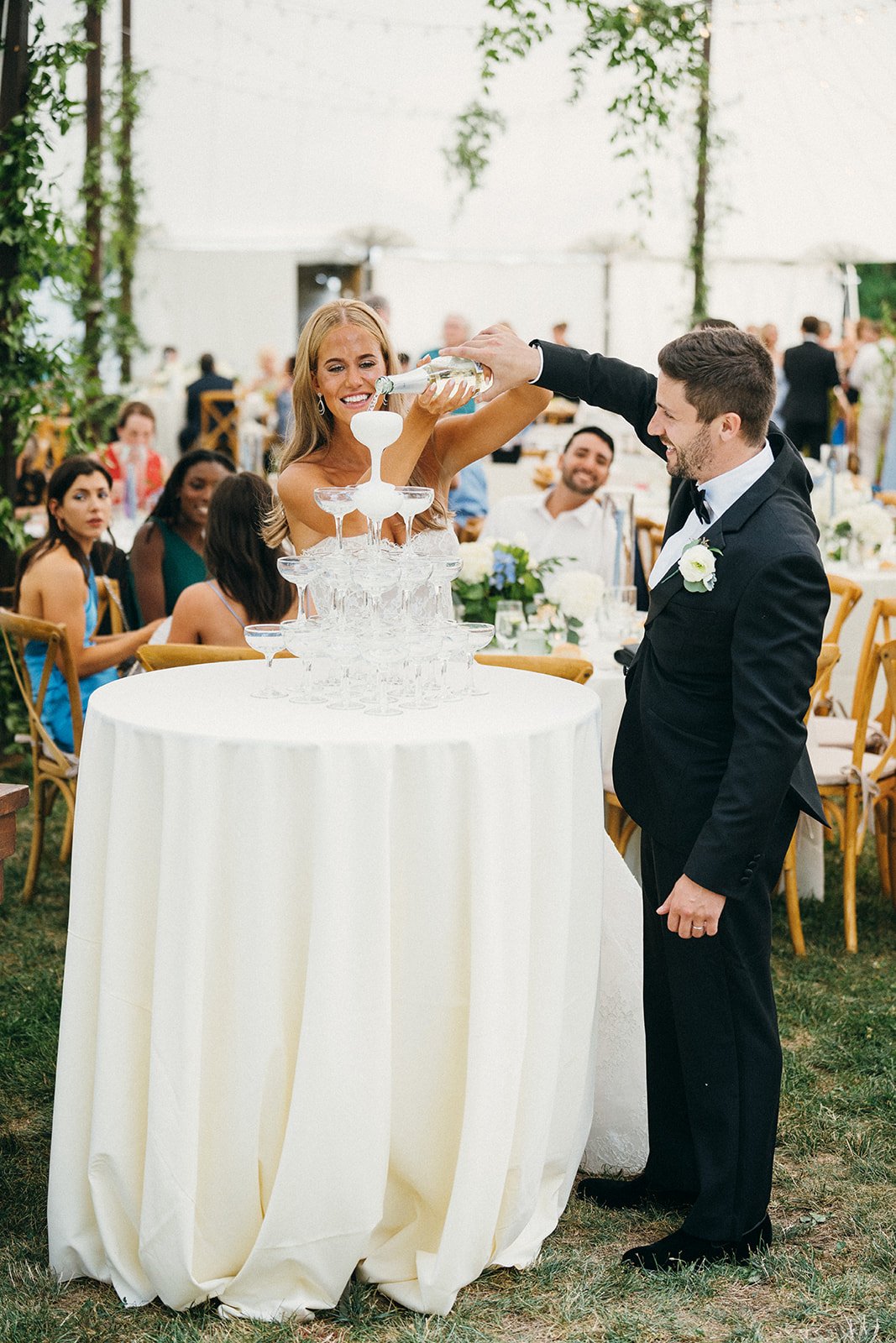 champagne-tower-bride-and-groom-pouring-with-champagne-at-hudson-valley-ny-outdoor-tented-wedding