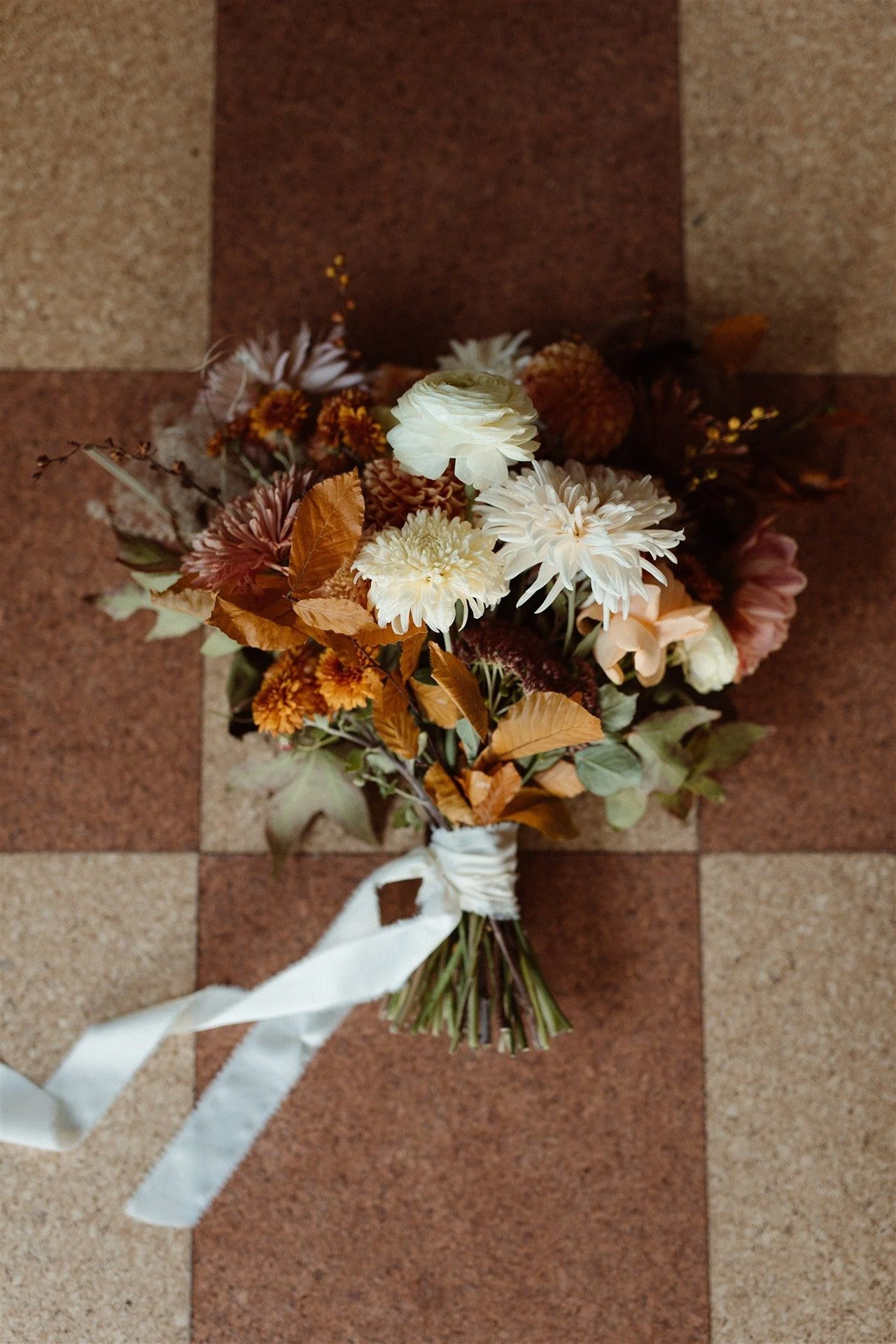 Fall-Colored-And-Autumn-Colored-Bridal-Bouquet-With-White-Trailing-Ribbon