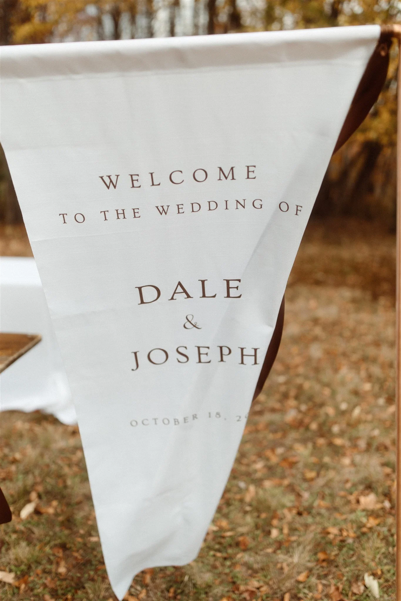 fabric-wedding-welcome-sign-on-copper-stand.jpg