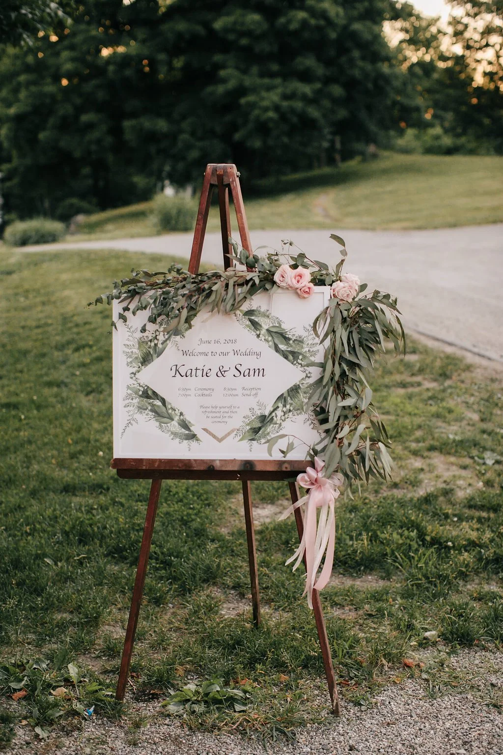 green-and-blush-pink-wedding-welcome-sign-on-easel.jpg