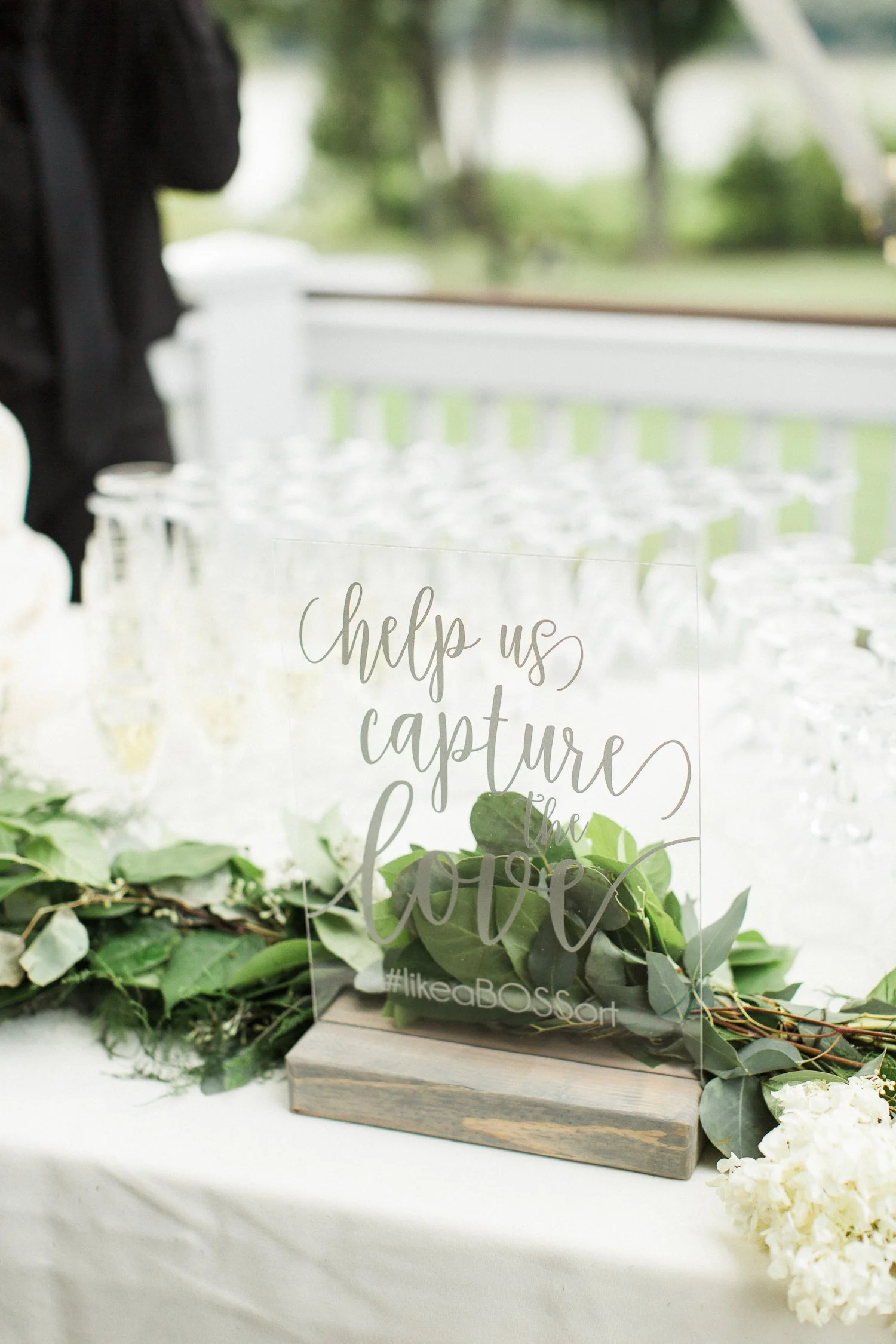 help-us-capture-the-love-acrylic-clear-sign-with-silver-lettering.jpg
