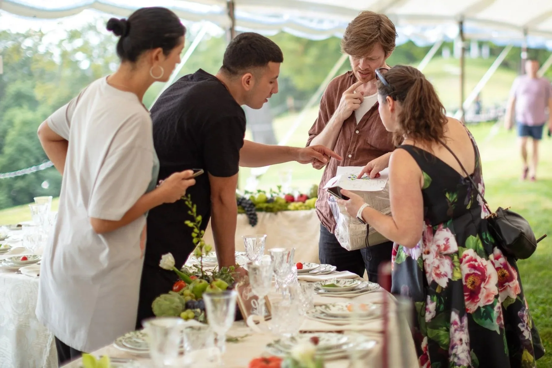 hudson-valley-wedding-planner-and-caterer-working-on-logistics-while-setting-up-wedding