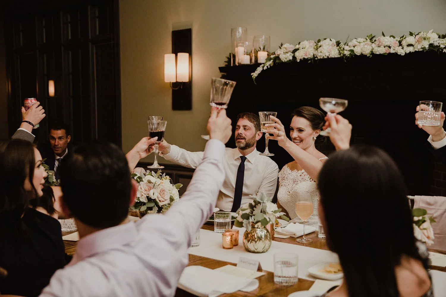 hudson-valley-wedding-planners-photo-of-bride-groom-and-head-table-tasting-with-drinks-in-hand