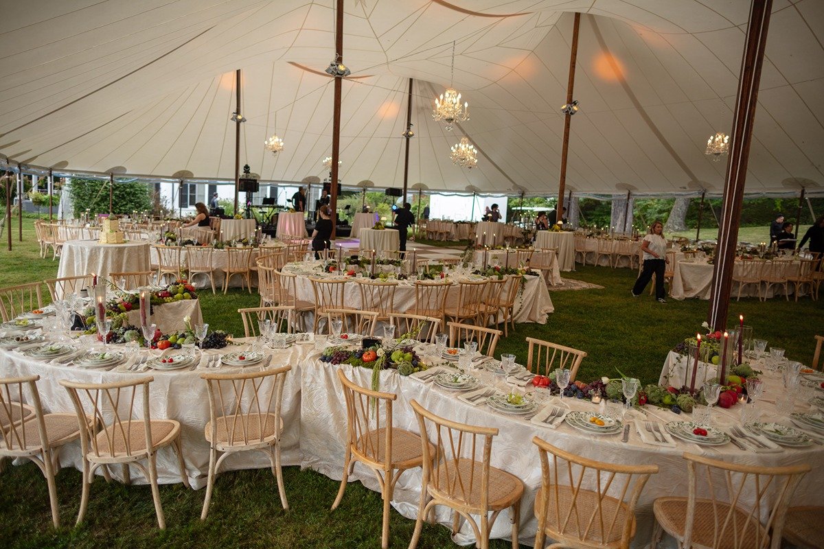 hudson-valley-wedding-planner-garden-feast-wedding-curved-serpentine-tables-with-harringbone-chairs-under-sailcloth-tent.jpg