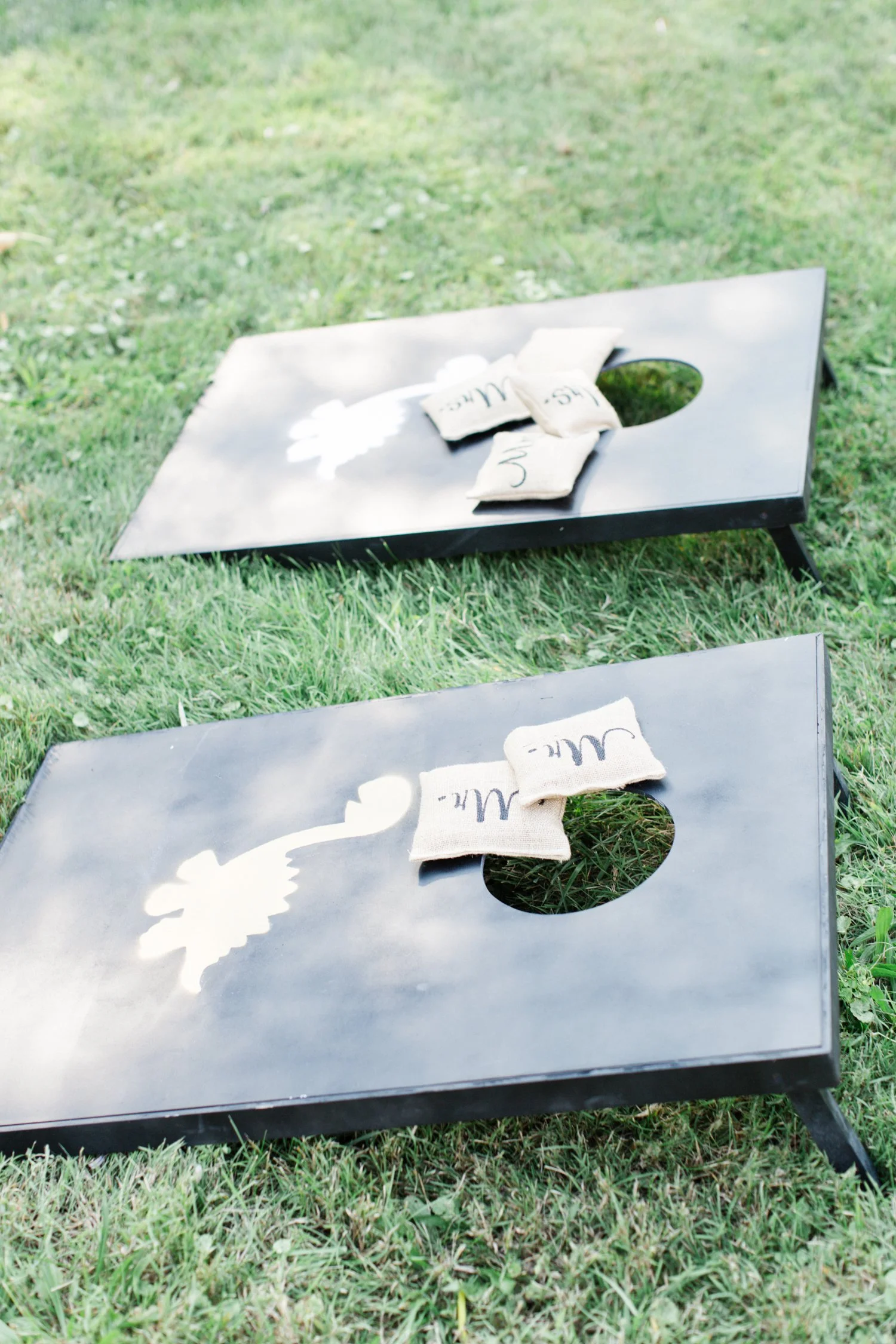 dinosaur-custom-corn-hole-game-at-outdoor-barn-wedding-in-hudson-valley-ny