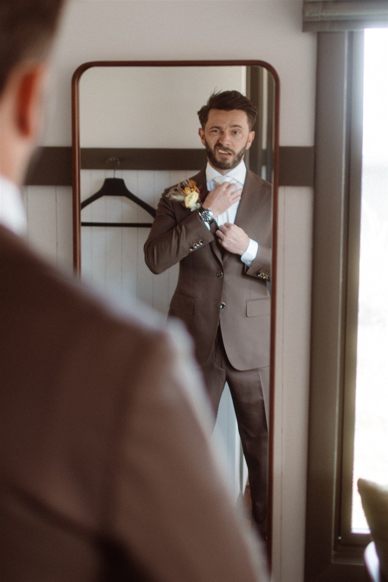 The-Groom-Making-A-Funny-Face-While-Getting-Ready-For-His-Hudson-Valley-Outdoor-Ceremony