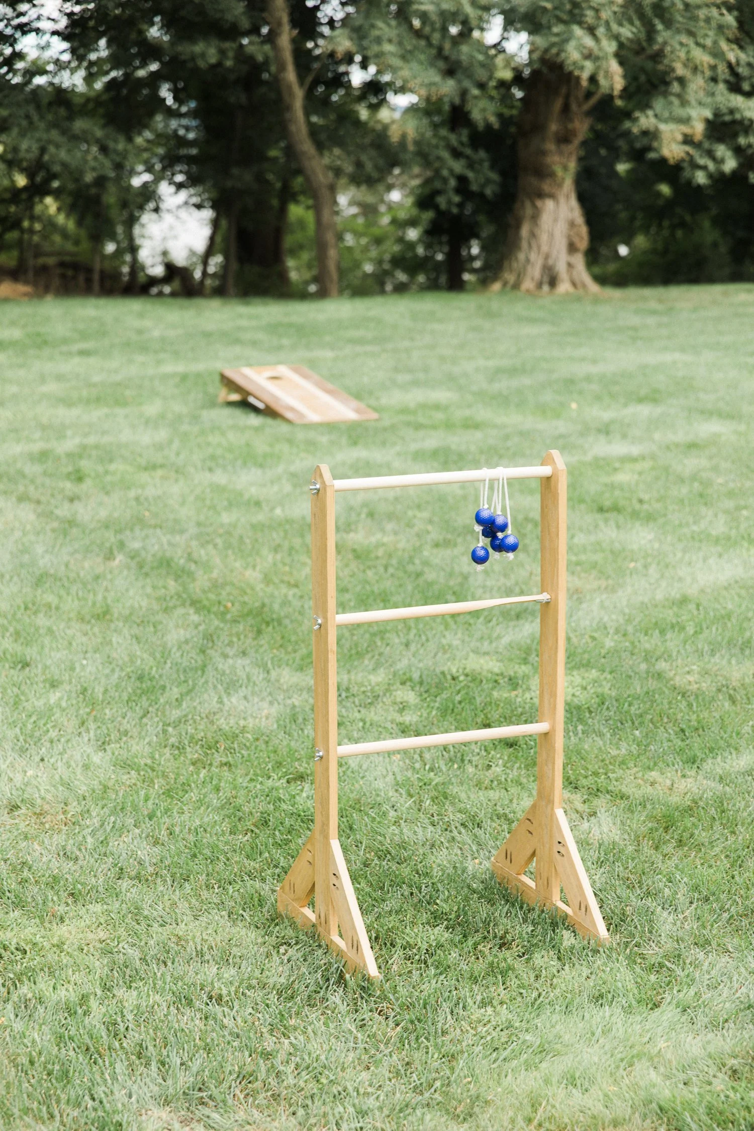 ladderball-lawn-game-at-outdoor-wedding-at-monteverde-at-oldstone-in-hudson-valley-ny