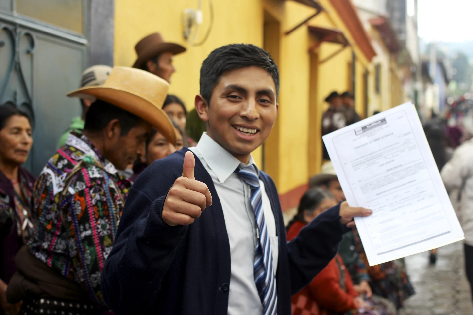 Miguel Jeatz Coj, on the day of his high school graduation in Solola, celebrating with his family.