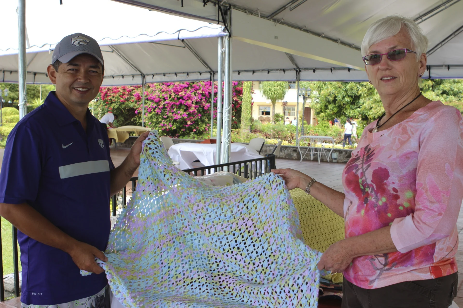 June met Dr. Francisco while studying Spanish in San Pedro, and told the rest of us "you've got to meet this guy." Here, she's delivering a Canadian-knitted baby blanket, for a future safe-delivery in Francisco's clinic.