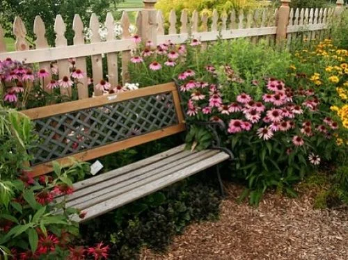 Benches are classic garden seating but awkward for conversation. — vikram/CC