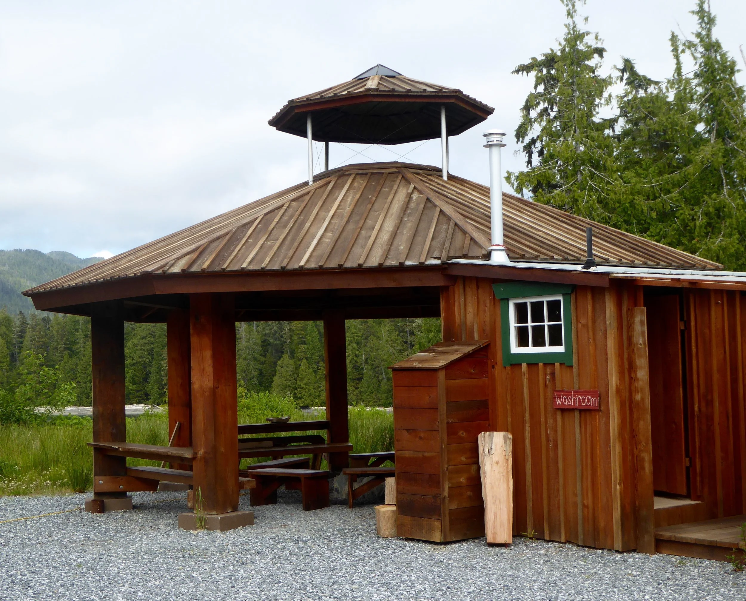 A meeting area with a unique fire ring in the middle.