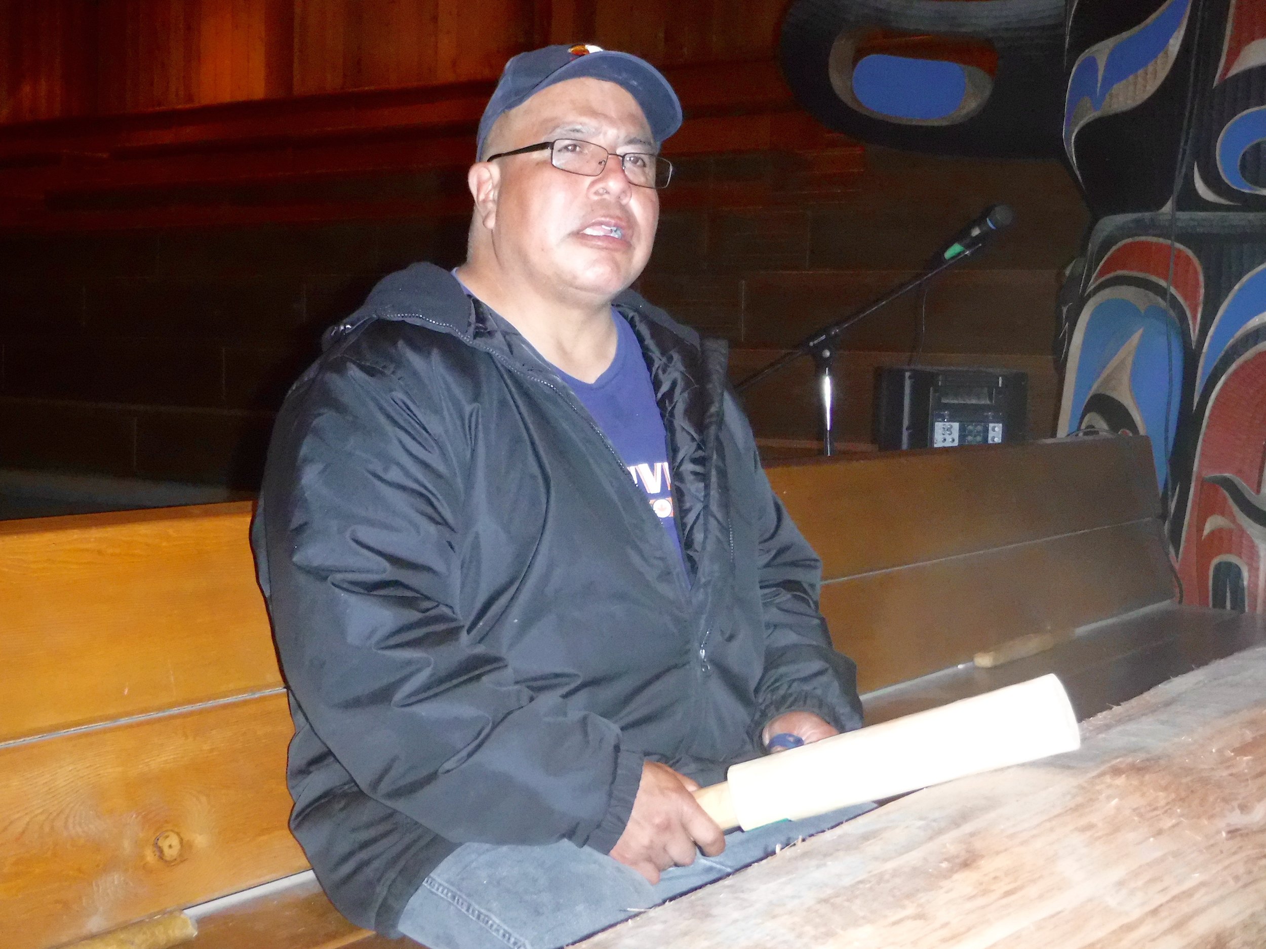 Drumming on a cedar drum