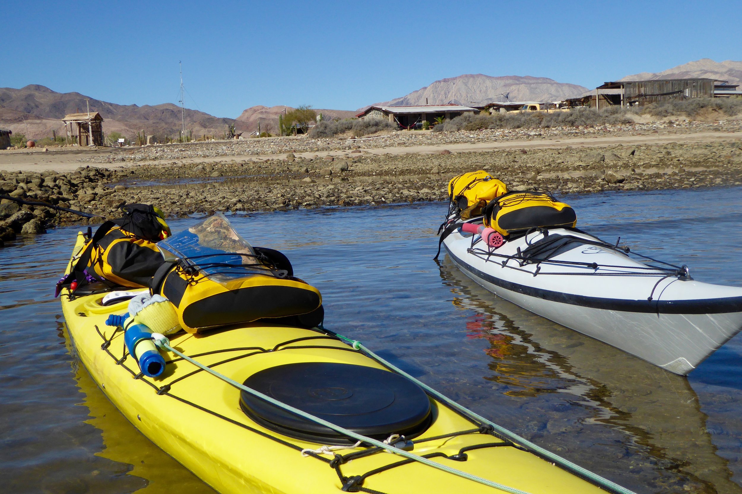 At least they are still afloat! Wayne comes to the beach and we wave adios. We are off to unexplored coast line.