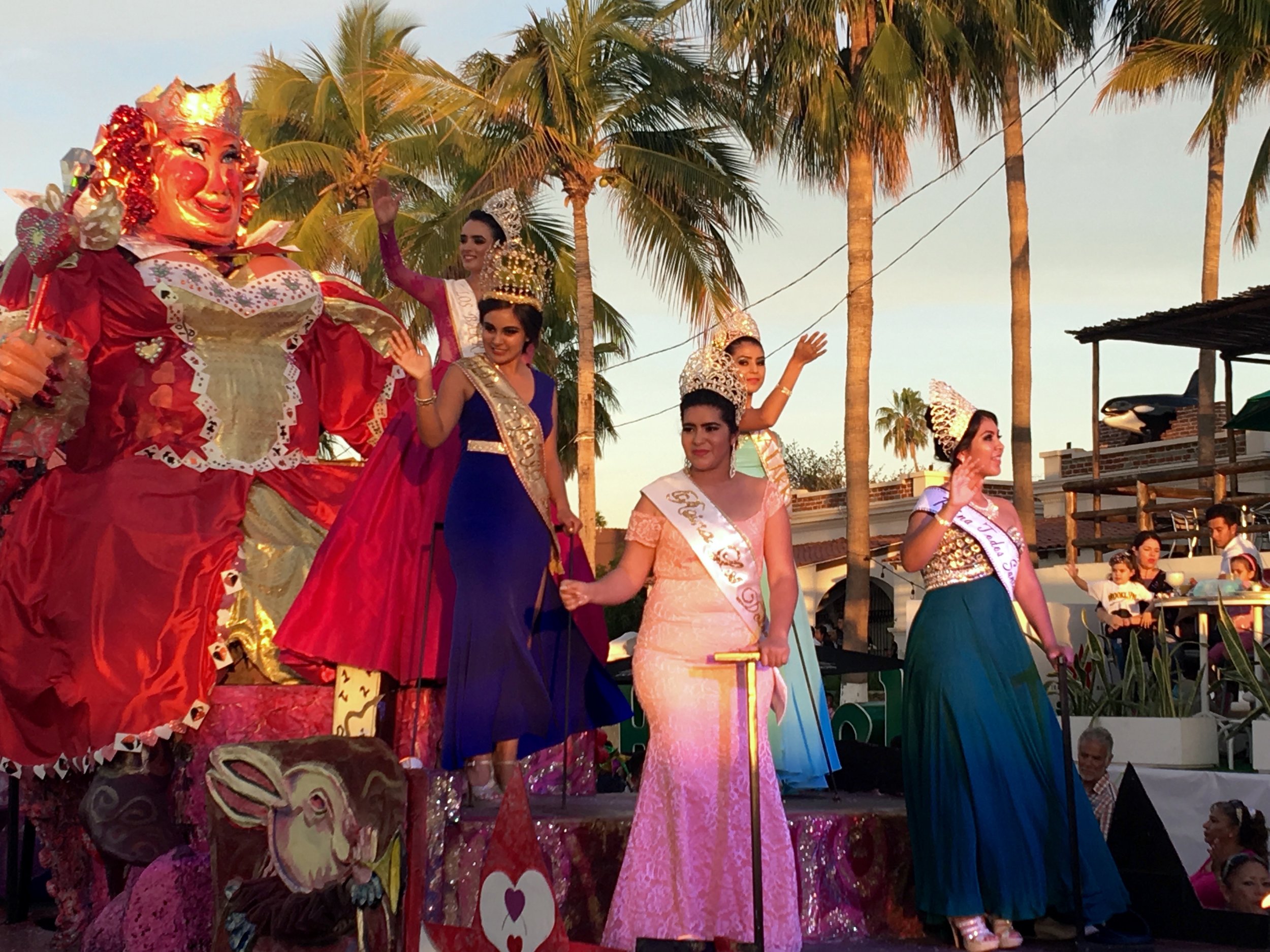 Lots of pretty ladies waving to the crowds.