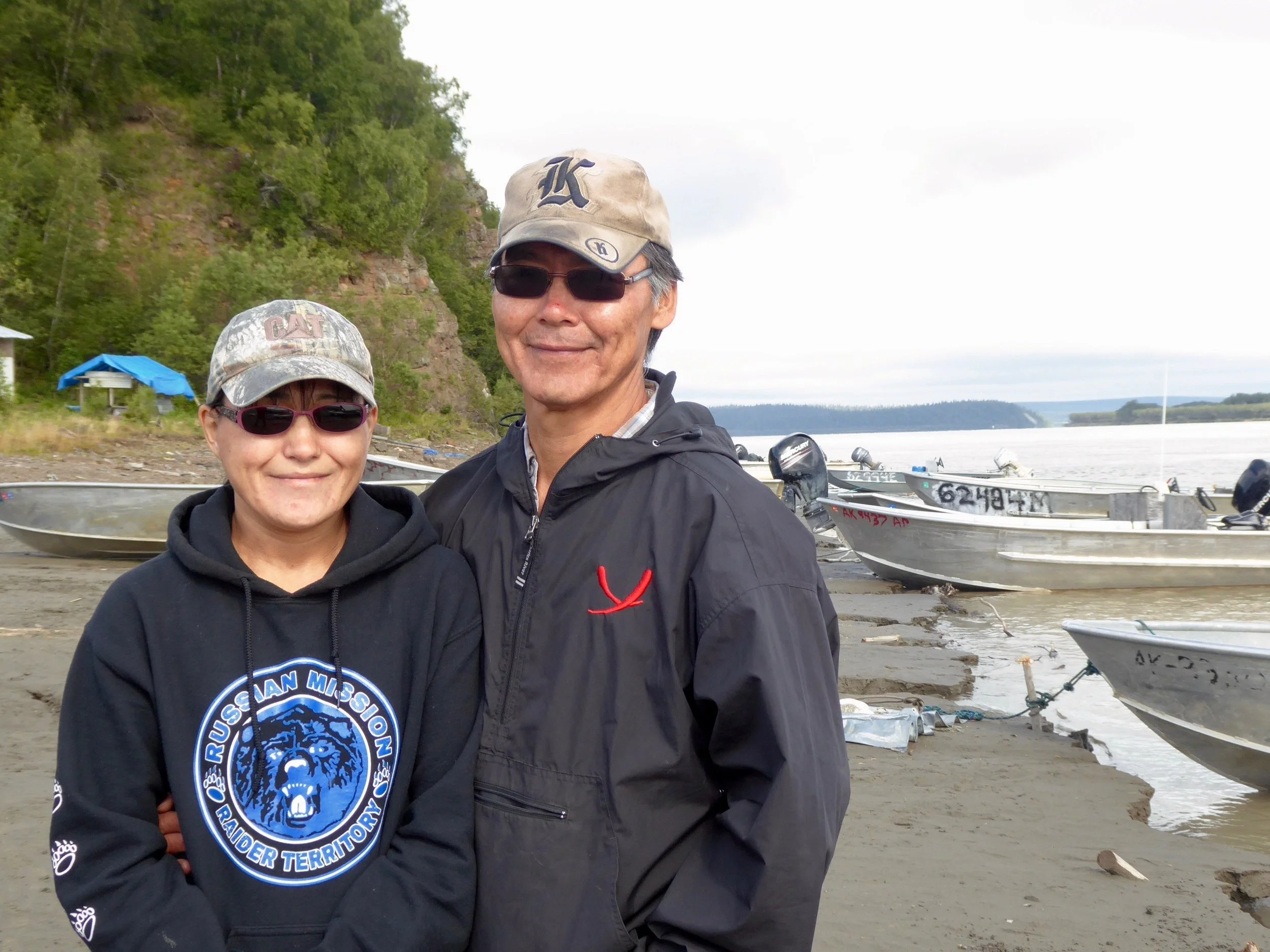 Mathew's great great grandfather was a pilot for the steamboats on the Yukon. Mathew has retraced his journey on a boat going up the Yukon. Both Dolores and Mathew have lived in various towns in Alaska, but are glad to be living here. Dolores tells us of berry picking with the women in the mountains and Matthew tells us about his fish camp. Matthew tells us when the mist starts rising on the river in the morning, the silver salmon are on their way to their spawning grounds. This year has also been a good year for King Salmon. In fact this is the first time in six years that they have been able to keep King Salmon going up the river. We say our good-bys and head down the river. Tomorrow we will be heading to the southern most part of the Yukon then turning North to the Bering Sea. When we reach our camp for the night we discover that someone has had a nice meal. Only the beautiful feathers are left.