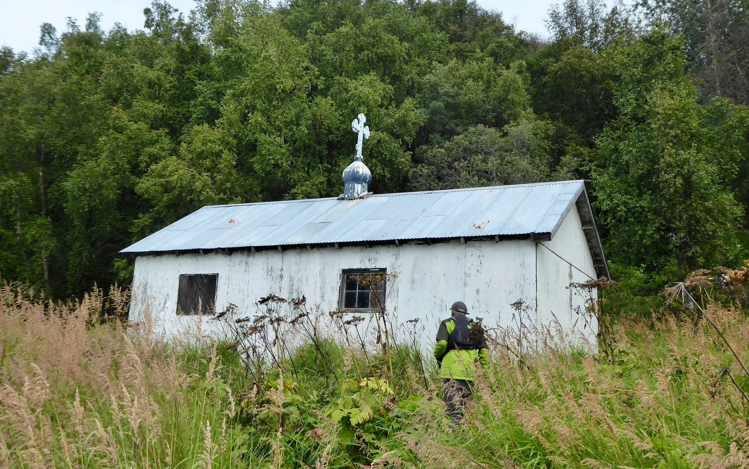 There are some older graves around the back of the church, but there is a well maintained one right near the church.