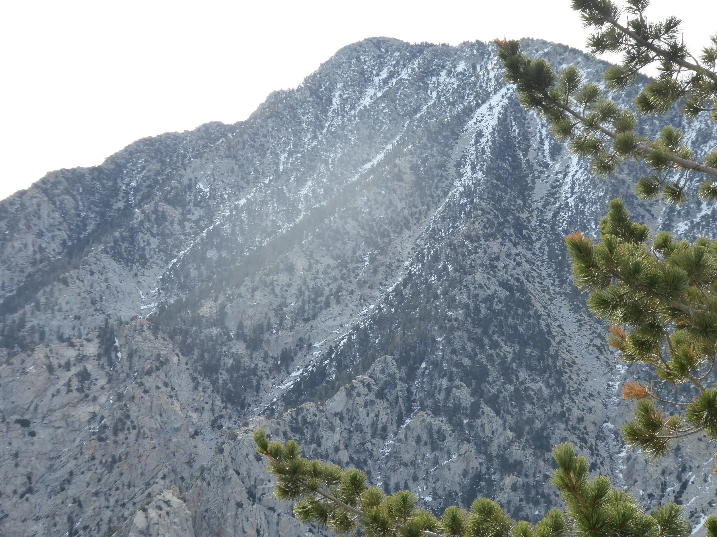There was fresh snow on the top. In the other direction we looked down to the valley floor, There is going to be a big descent today.