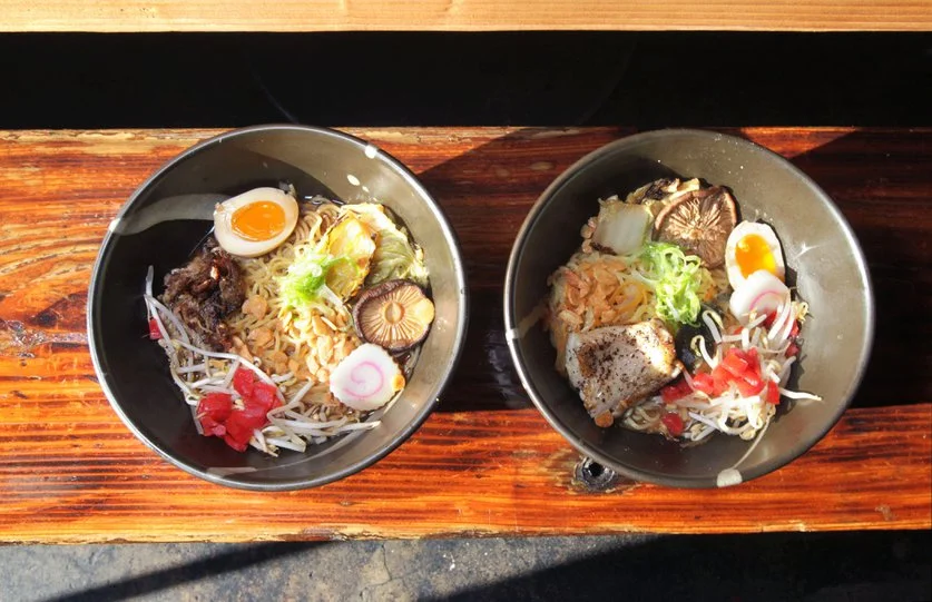 Detail view of two ramen noodle dishes at The Whet Noodle. At left is Duck Shoyu and at right is Hot and Sour Miso, both with added egg. San Diego Union-Tribune