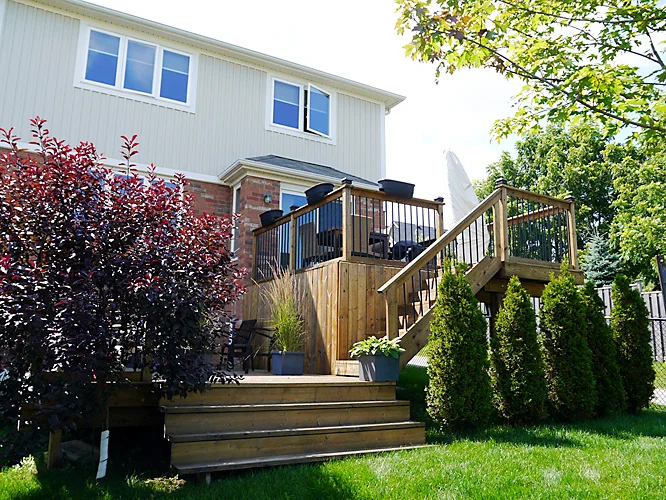 2-tier deck with skirting and custom steps, by Fred's Fences