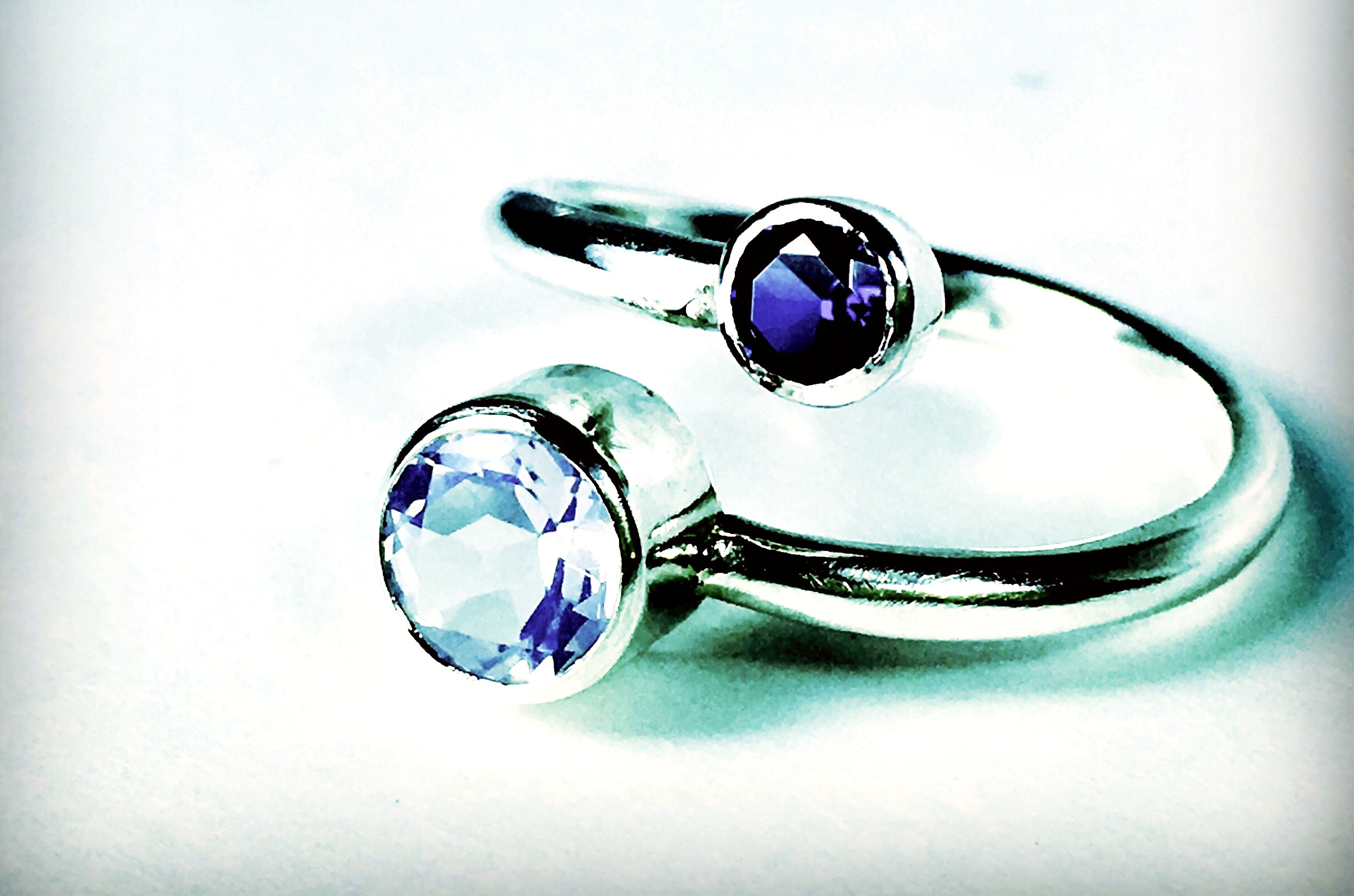 Jupiter and Io Ring, shown with blue sapphire and lavender quartz. 