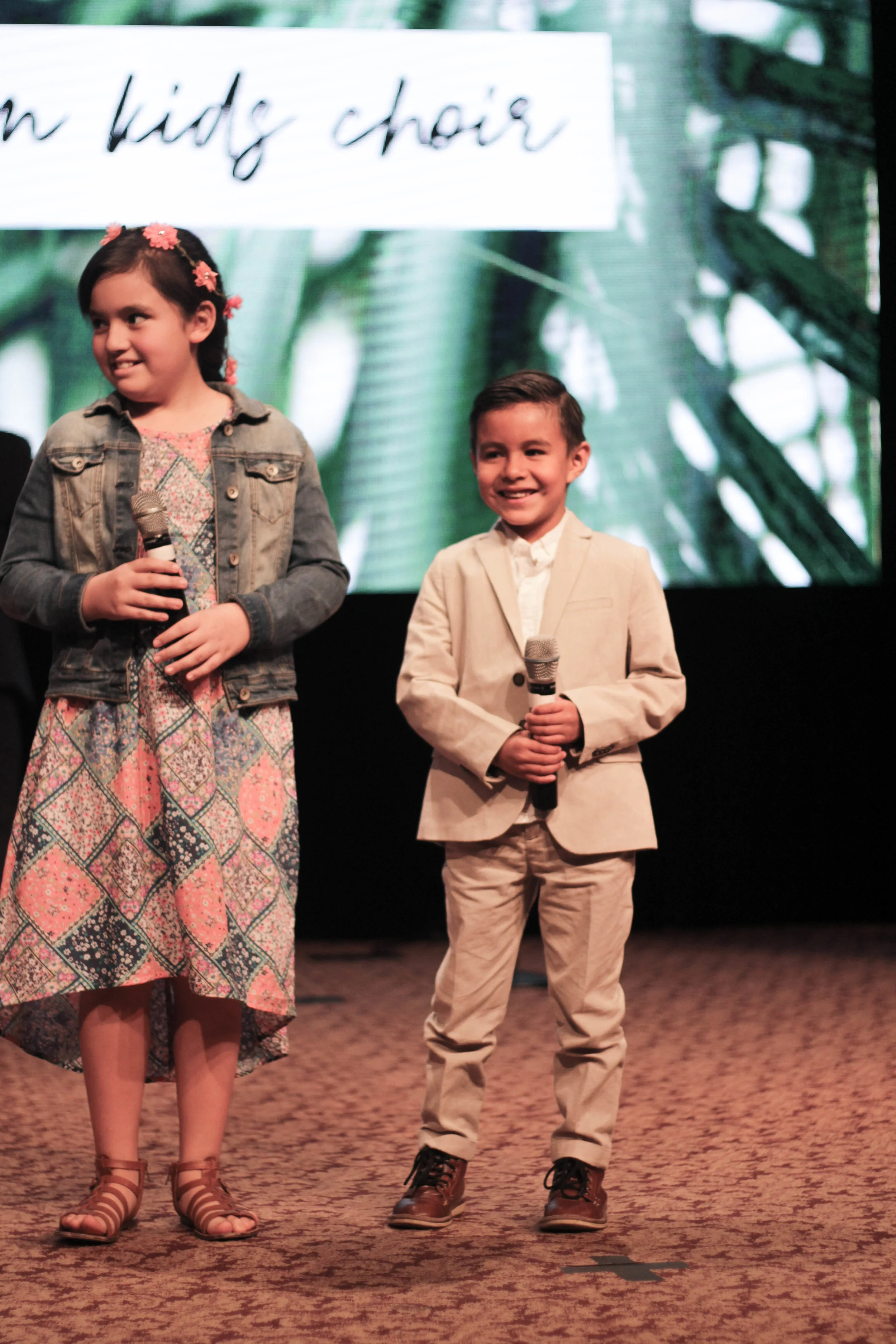 Asael singing with church kids choir
