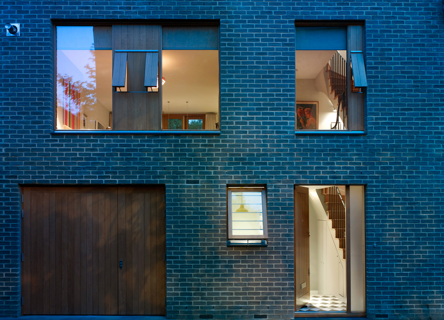 Front facade of Holland Park mews house, at night. A design project for Jill Scholes Interior Design