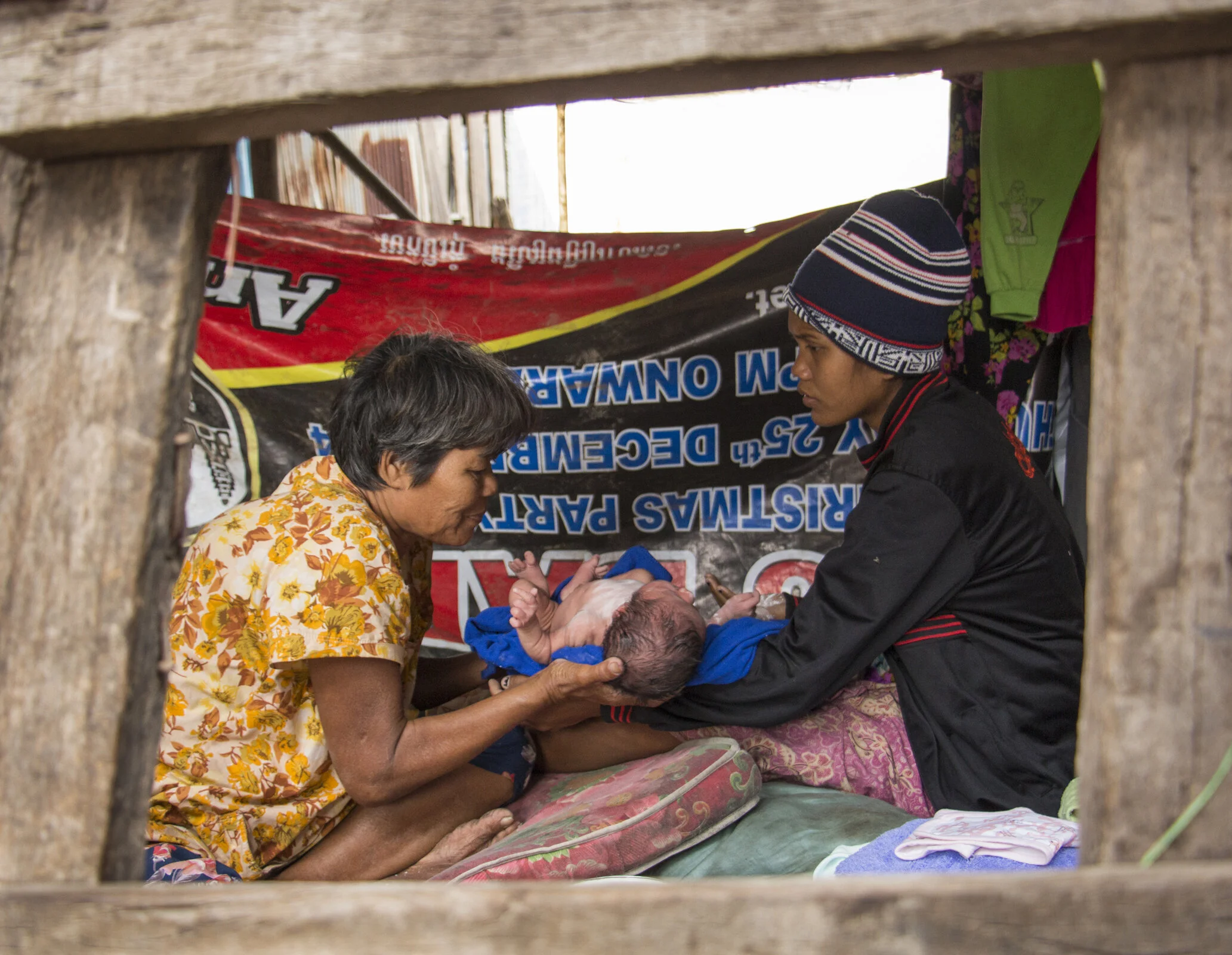  A family enjoys their latest addition in Phnom Penh, Cambodia, January 2016. 
