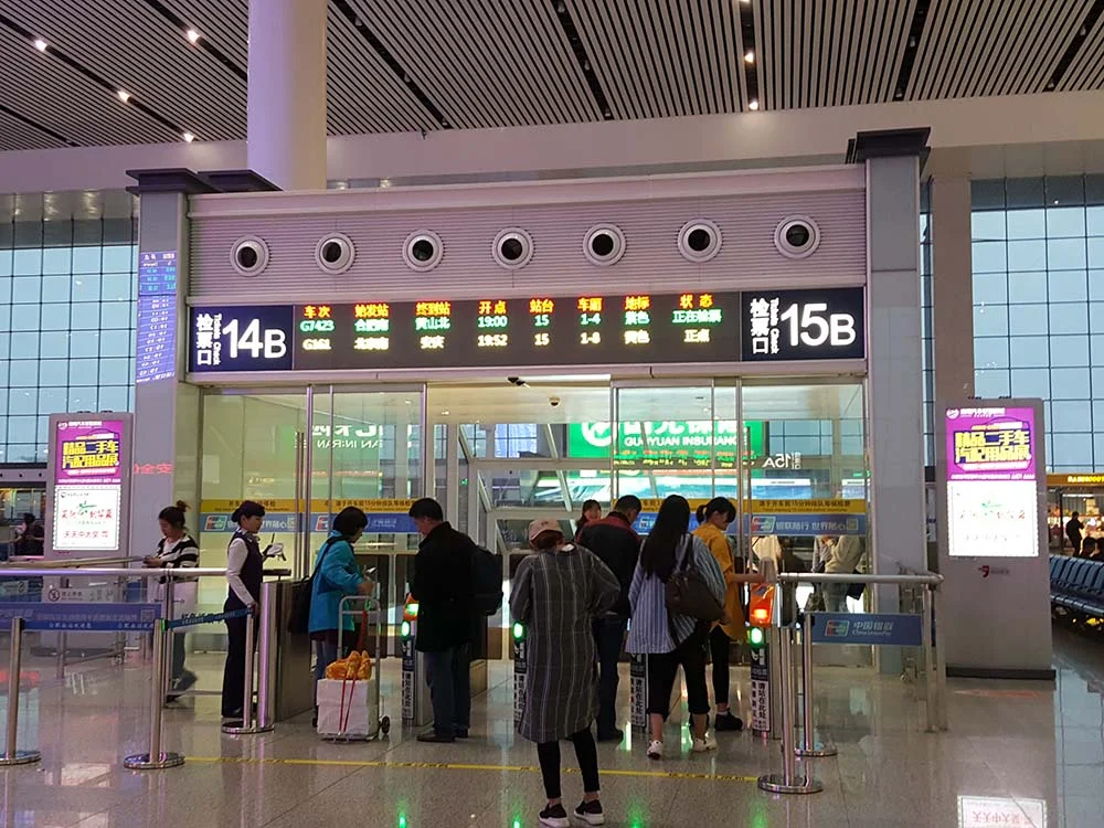 Passengers boarding at the gates inside the high speed railway station in Hefei, Anhui Province, China.