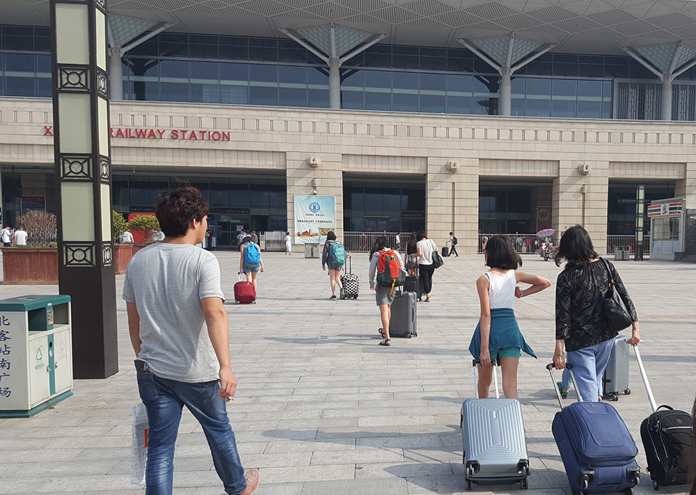 Moving through the Xi'An train station in China.