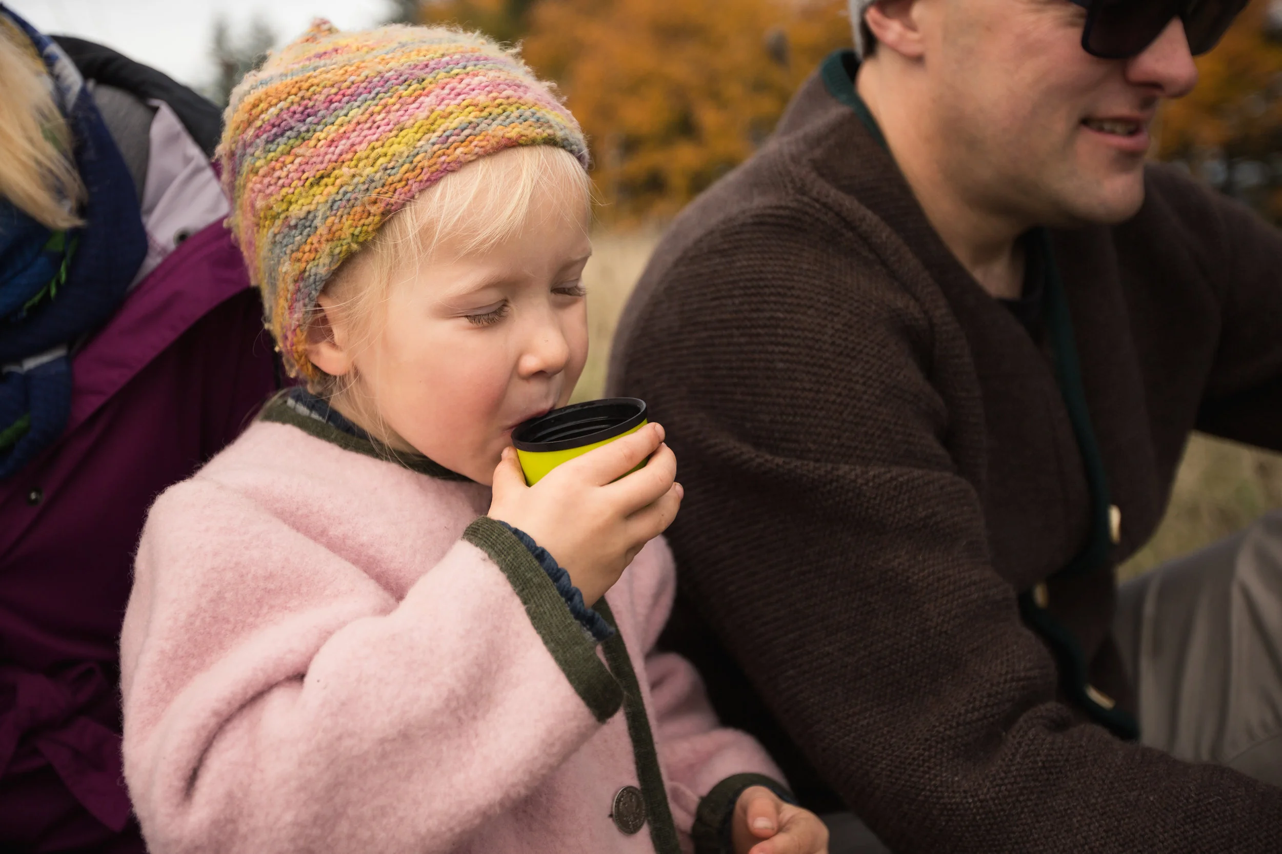 girl enjoying snack time drink