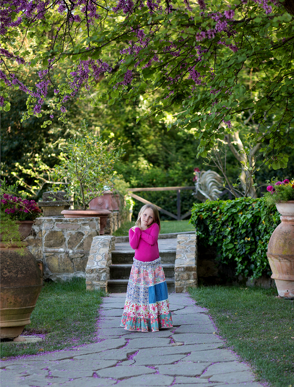 girl standing in garden tuscany