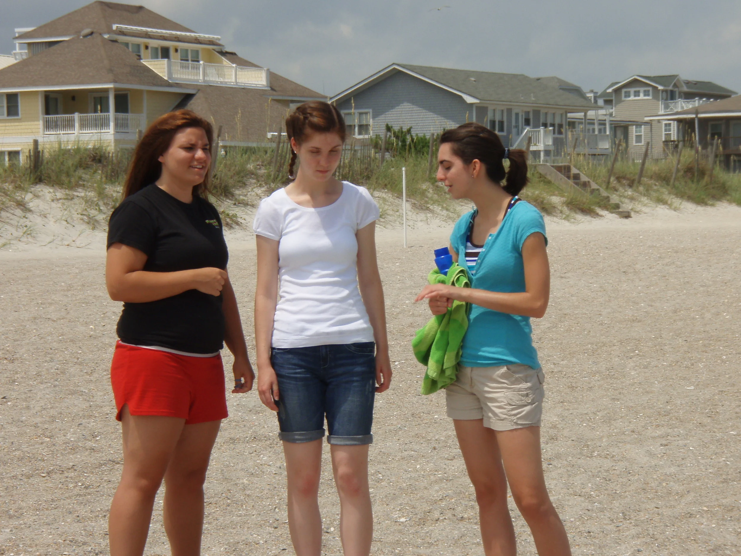 Some students are out sharing the Gospel of Christ on the beach.