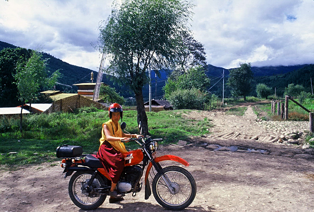 Bhutan.Bumthang.YoungMonkOnBike.jpg