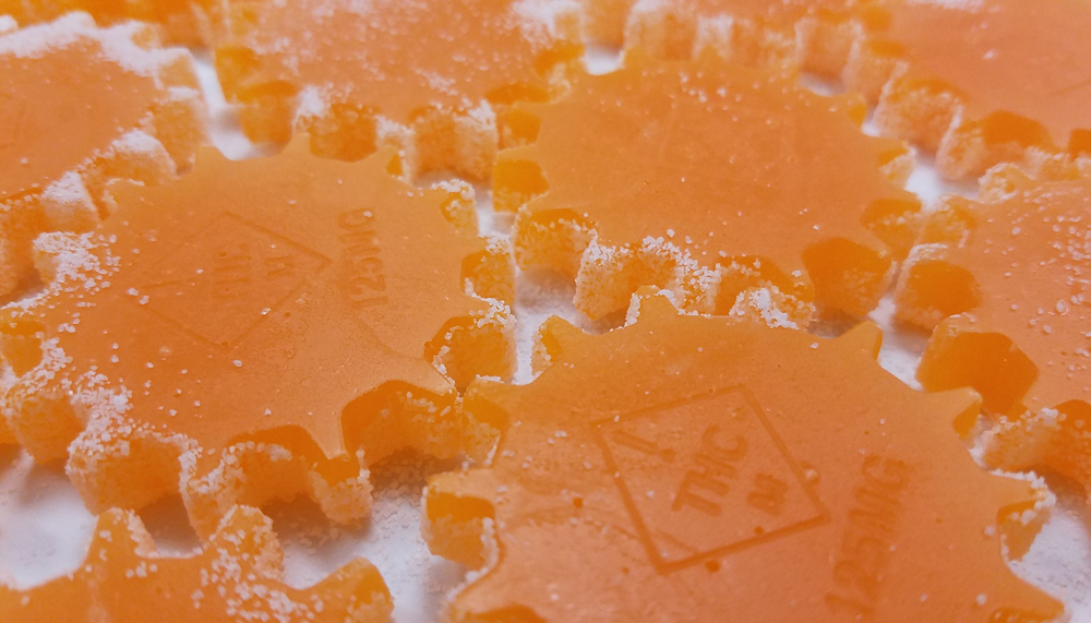 A zoom shot of our new 125mg single serve gummy - Mango flavor pictured. (Gummy measures 2.00" across)