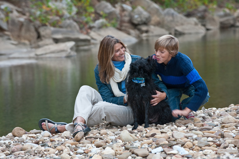 Mother and son with dog beside Buffalo River
