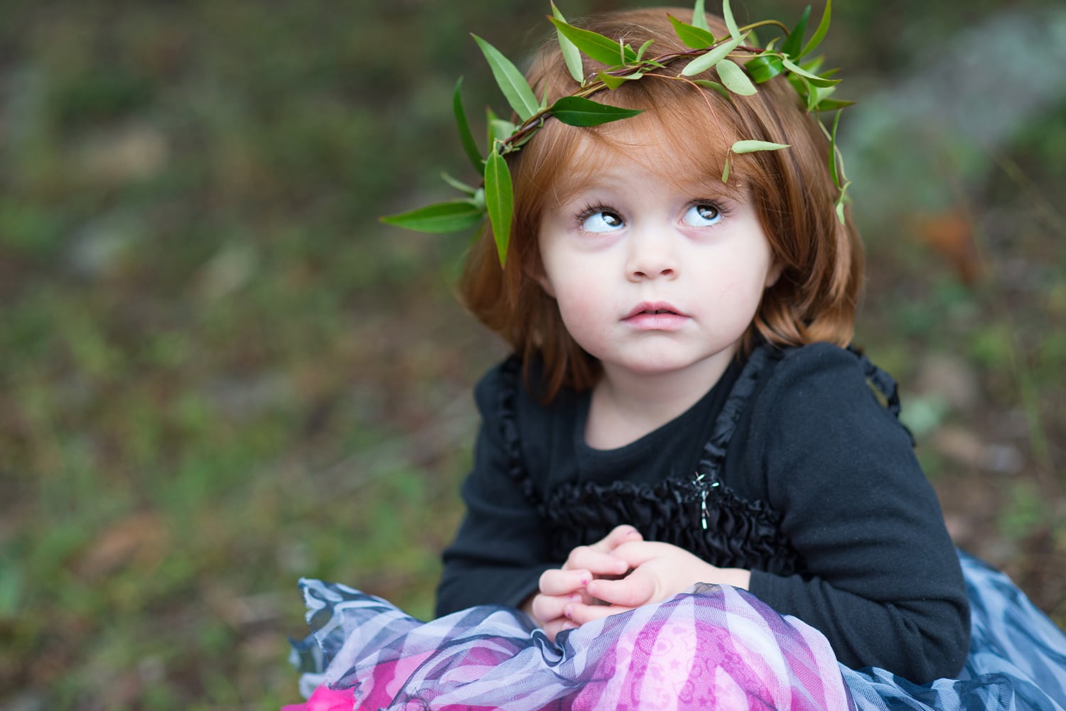 Little girl with grass halo wreath