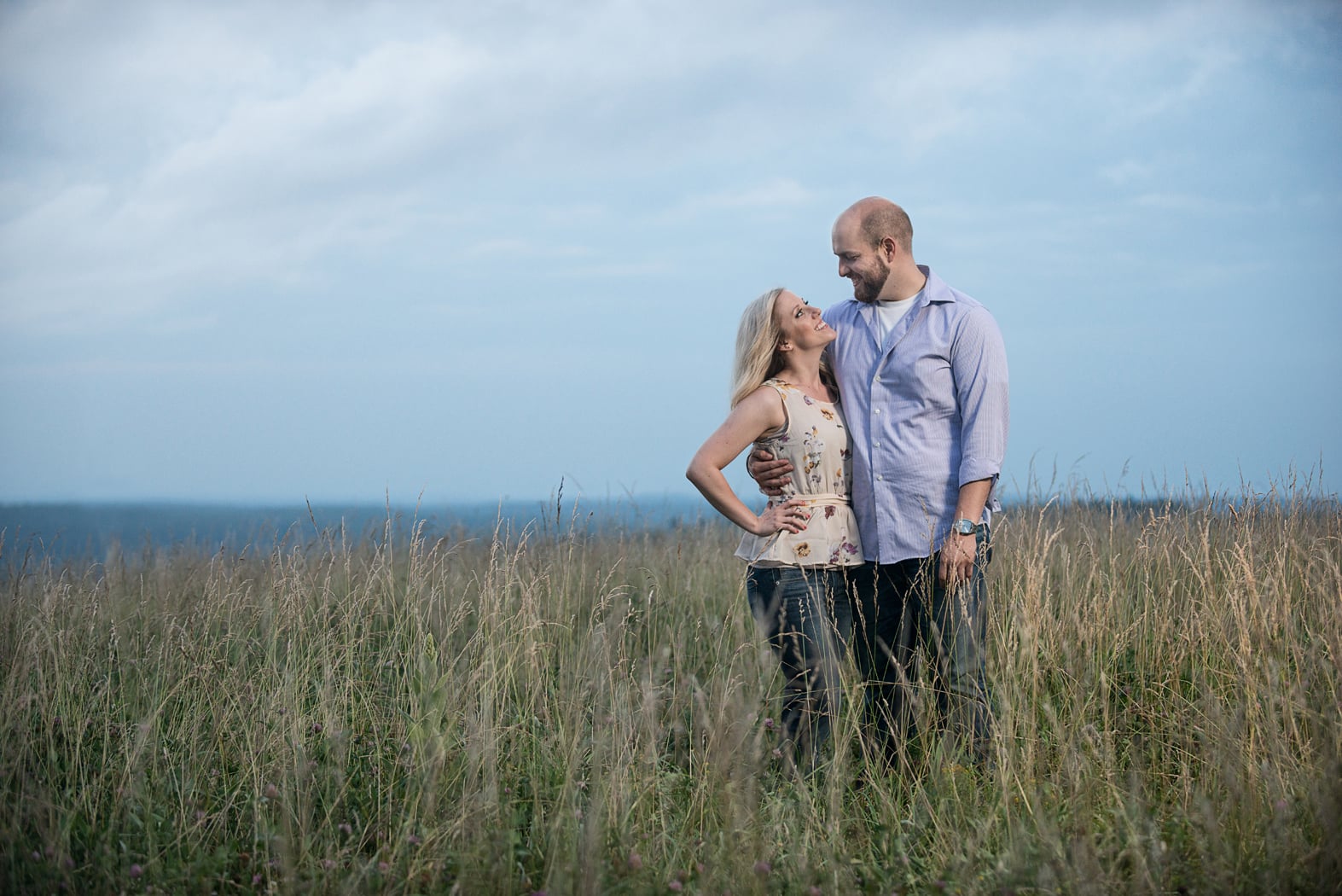 Couple in tall grass meadow