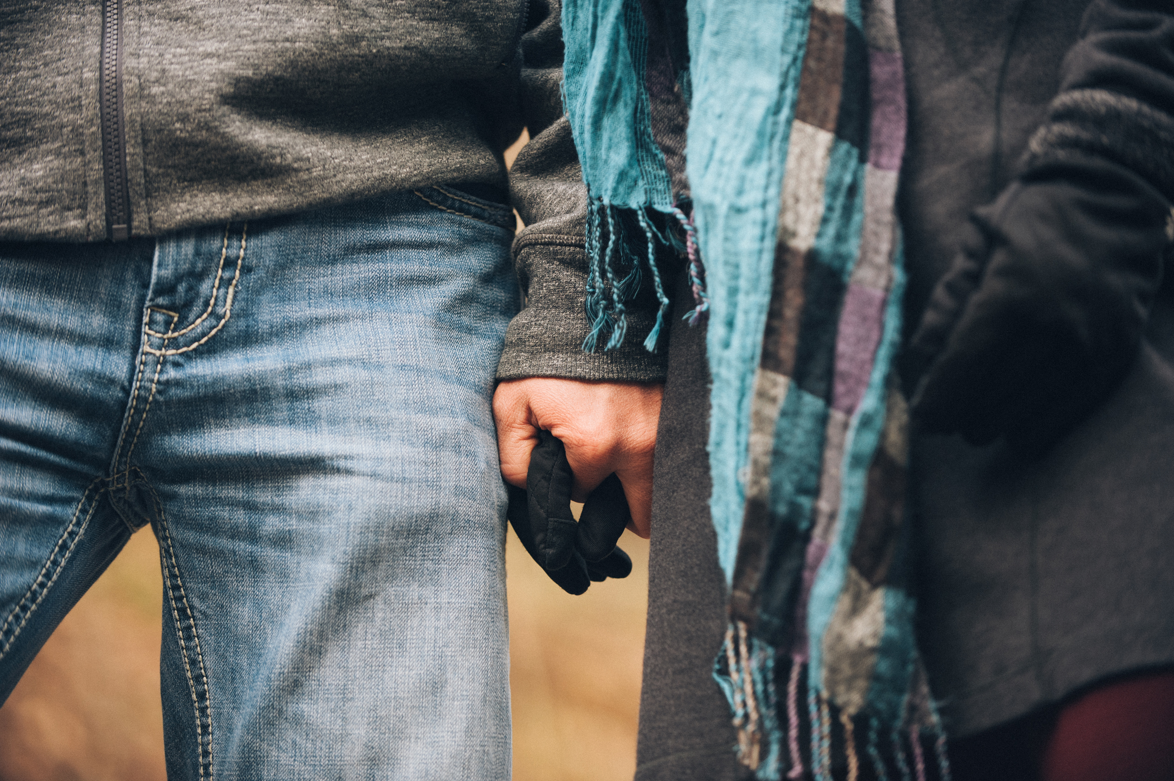 Engagement couple holding hands