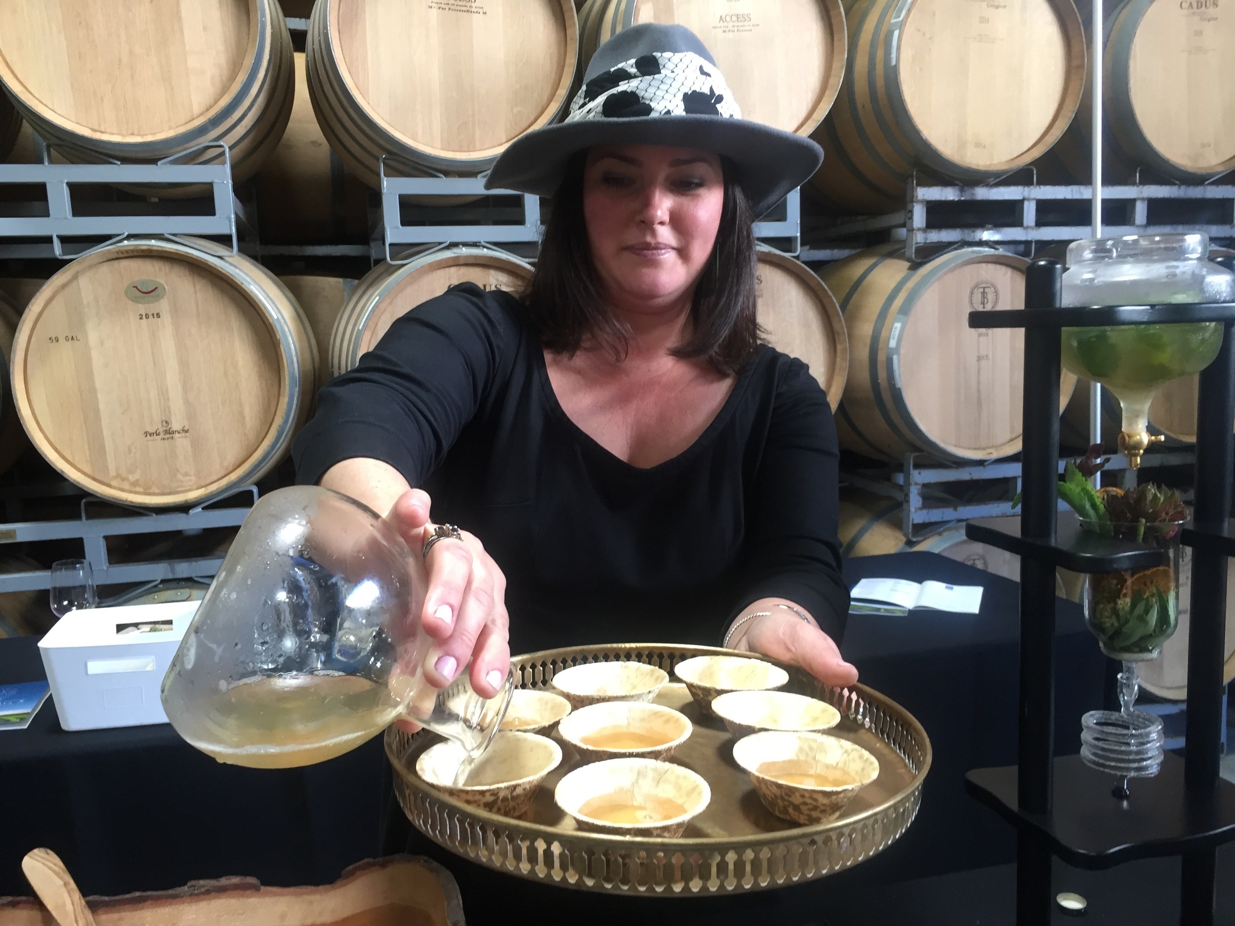 Katie from Bar Cart Cocktails Co. pouring some of her tasty tea!