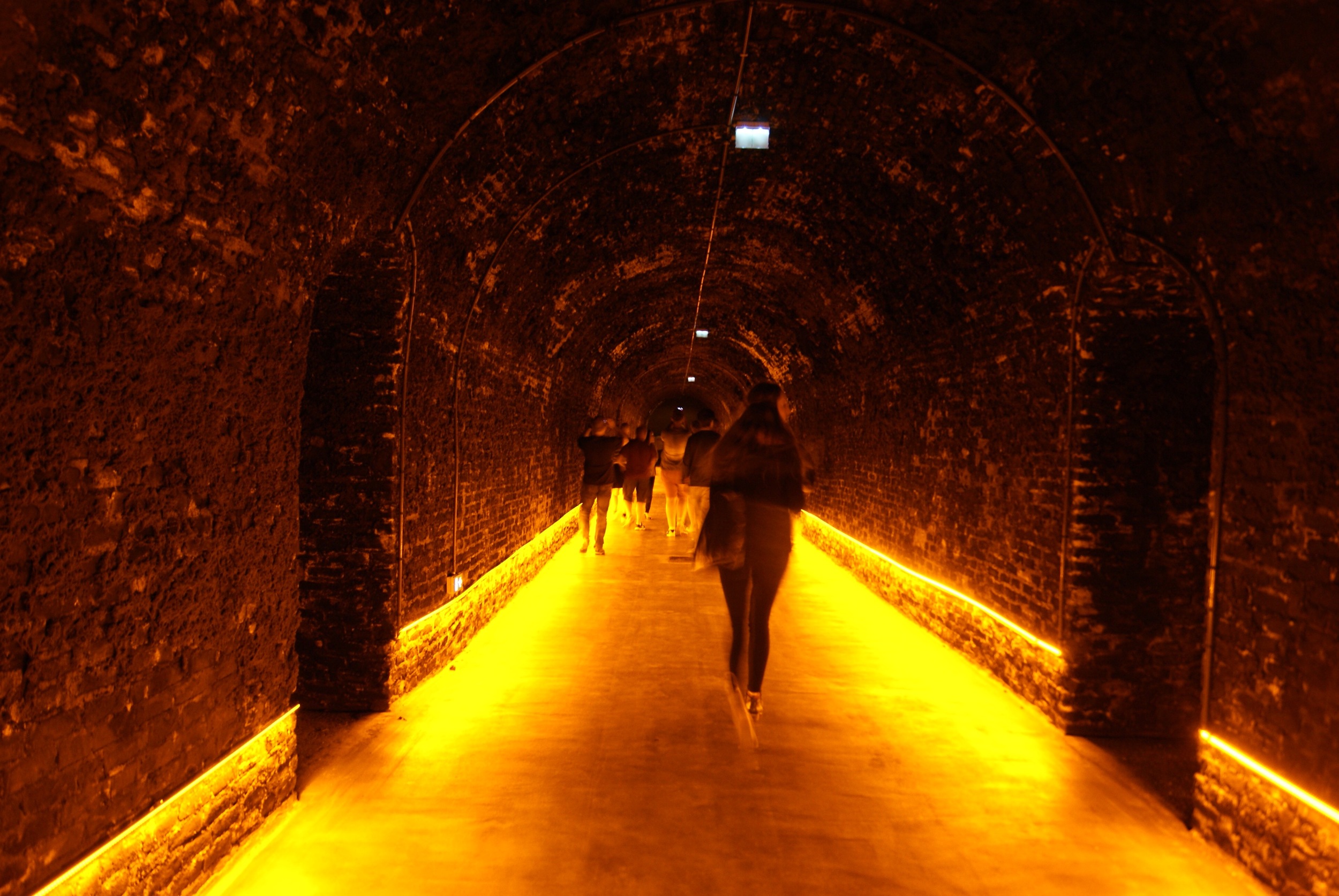Walking in Lansons Caves...they use special light bulbs that do not create heat and gives an orange glow to photos. 