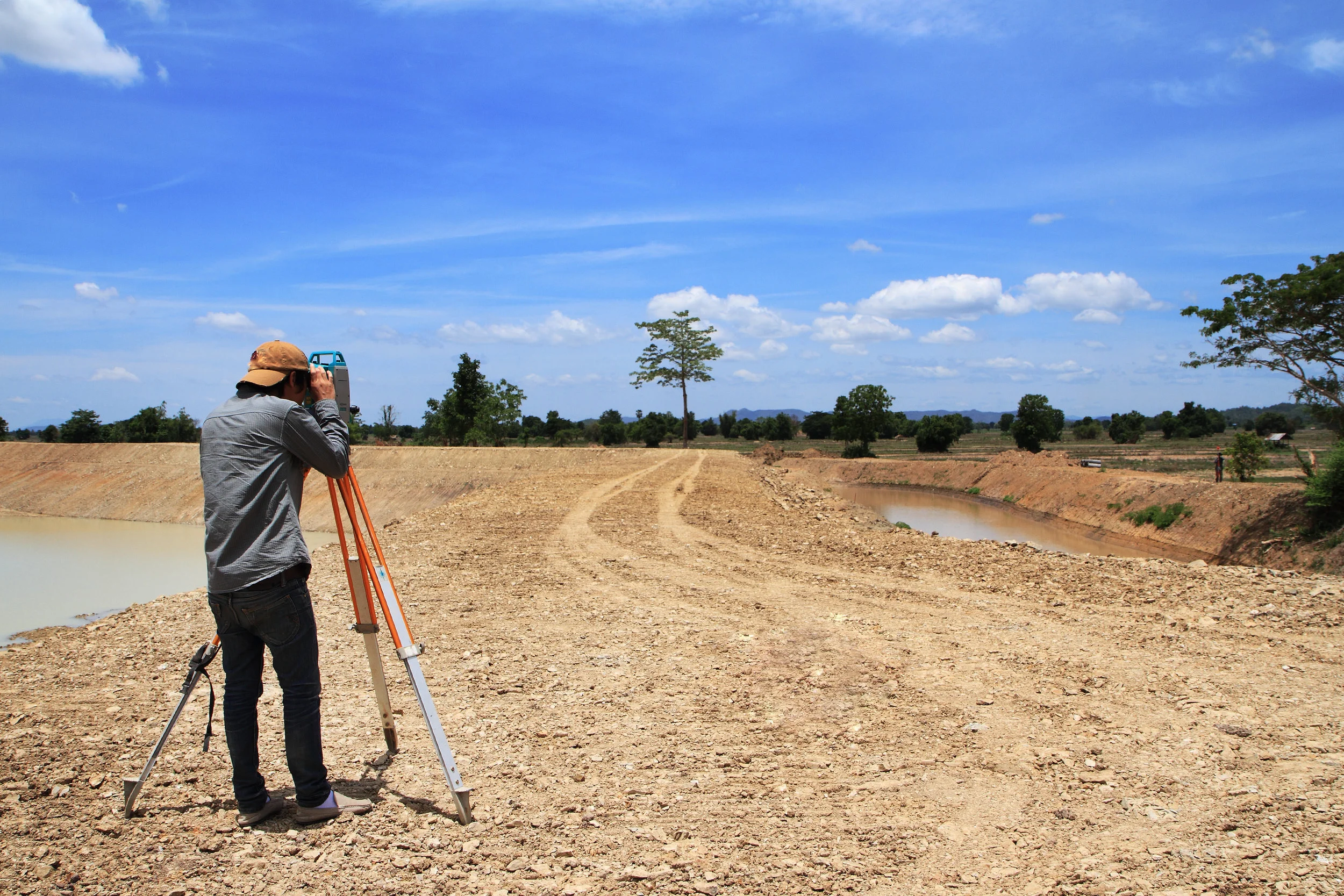 Surveyor conducting a feature and contour survey. 